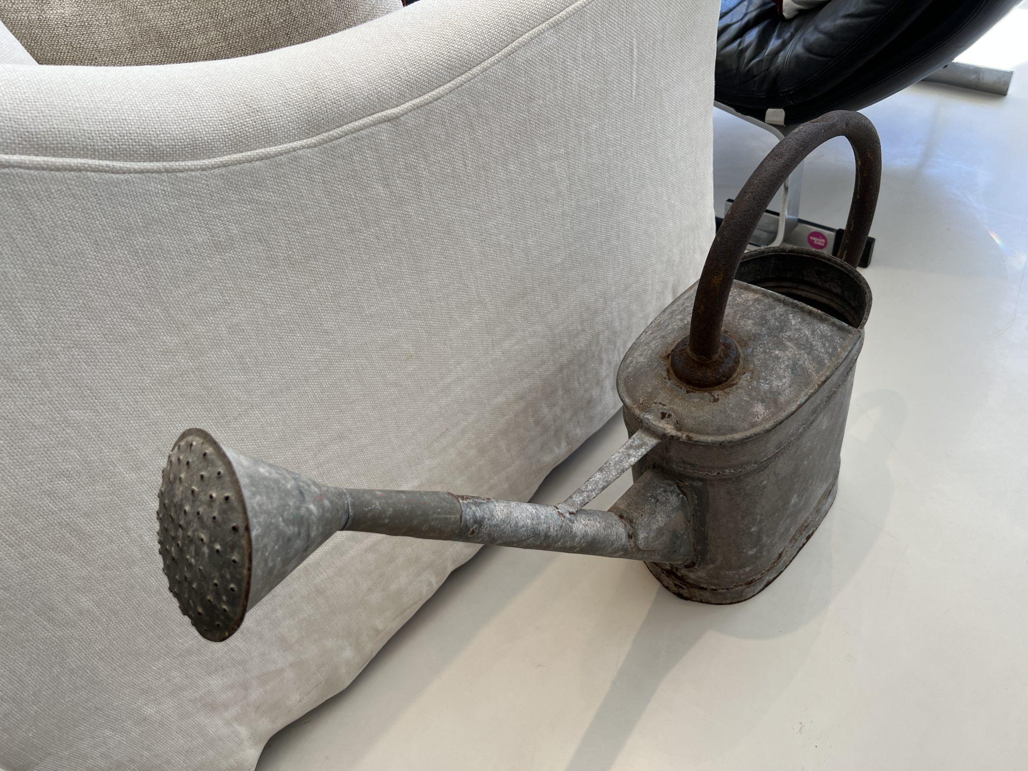 Charming rustic watering can with long spout.