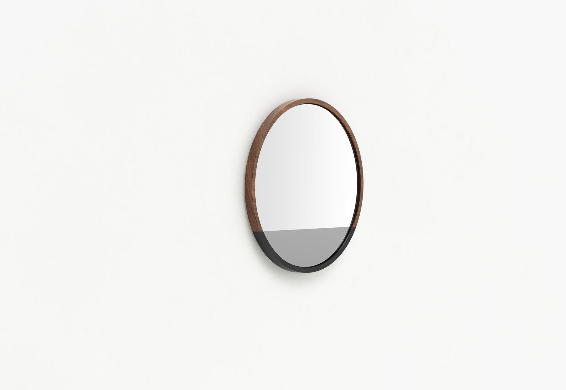 Our Waterline round mirror shares a story within its form. The elegant transitions of mirror and frame material echo the calm after a storm. The Waterline mirror was designed in remembrance of Hurricane Sandy and its aftermath on our hard-hit