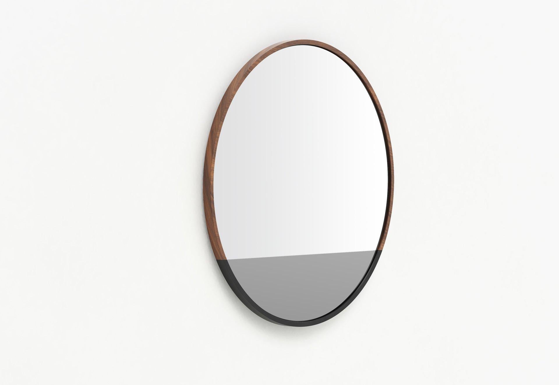 Our Waterline round mirror shares a story within its form. The elegant transitions of mirror and frame material echo the calm after a storm. The waterline mirror was designed in remembrance of Hurricane Sandy and its aftermath on our hard-hit