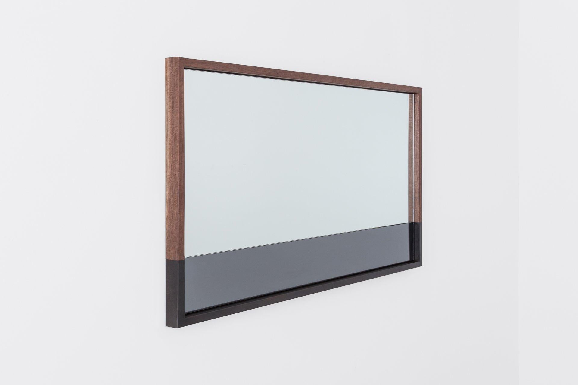 Our Waterline Landscape Mirror shares a story within its form. The elegant transitions of mirror and frame materials echo the calm after a storm. The Waterline Mirror was designed in remembrance of Hurricane Sandy and its aftermath on our hard-hit