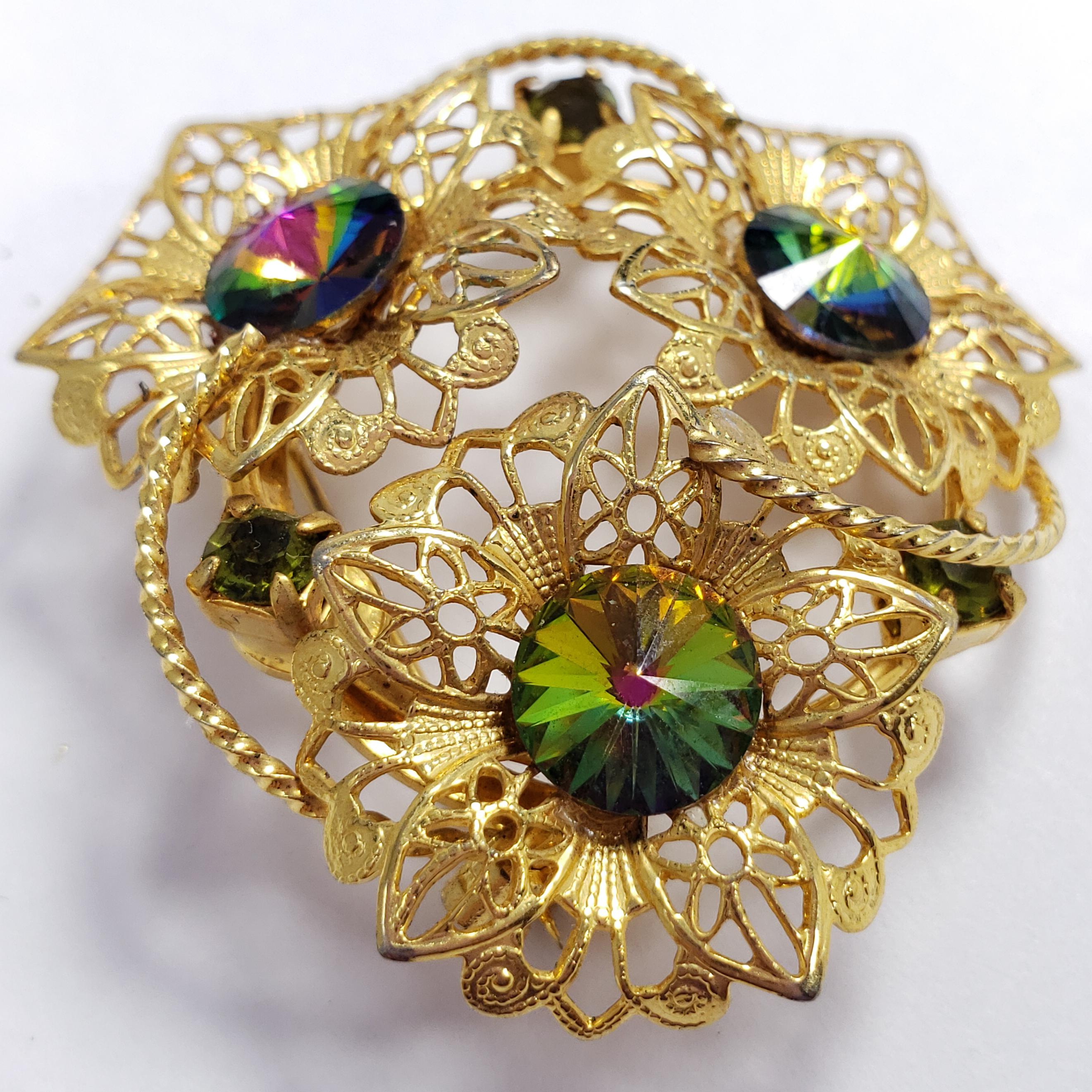 An art nouveau style vintage pin brooch, featuring three watermelon rivoli-cut crystals in mesmerizing colors, set on a floral-themed setting. An extravagant accessory!