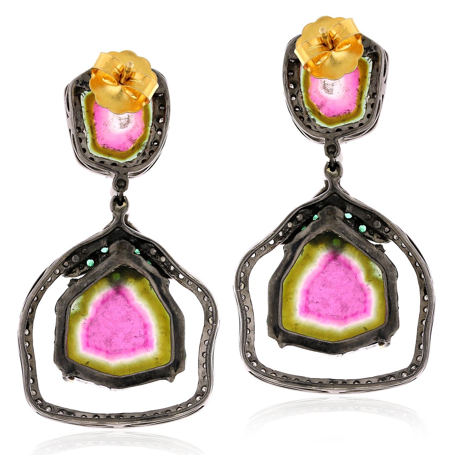 The watermelon tourmaline gemstones have a stunning pink and green color that is reminiscent of the fruit they are named after. The emerald gemstones add a rich, vibrant green color to the earrings, while the pave diamonds add a touch of sparkle and