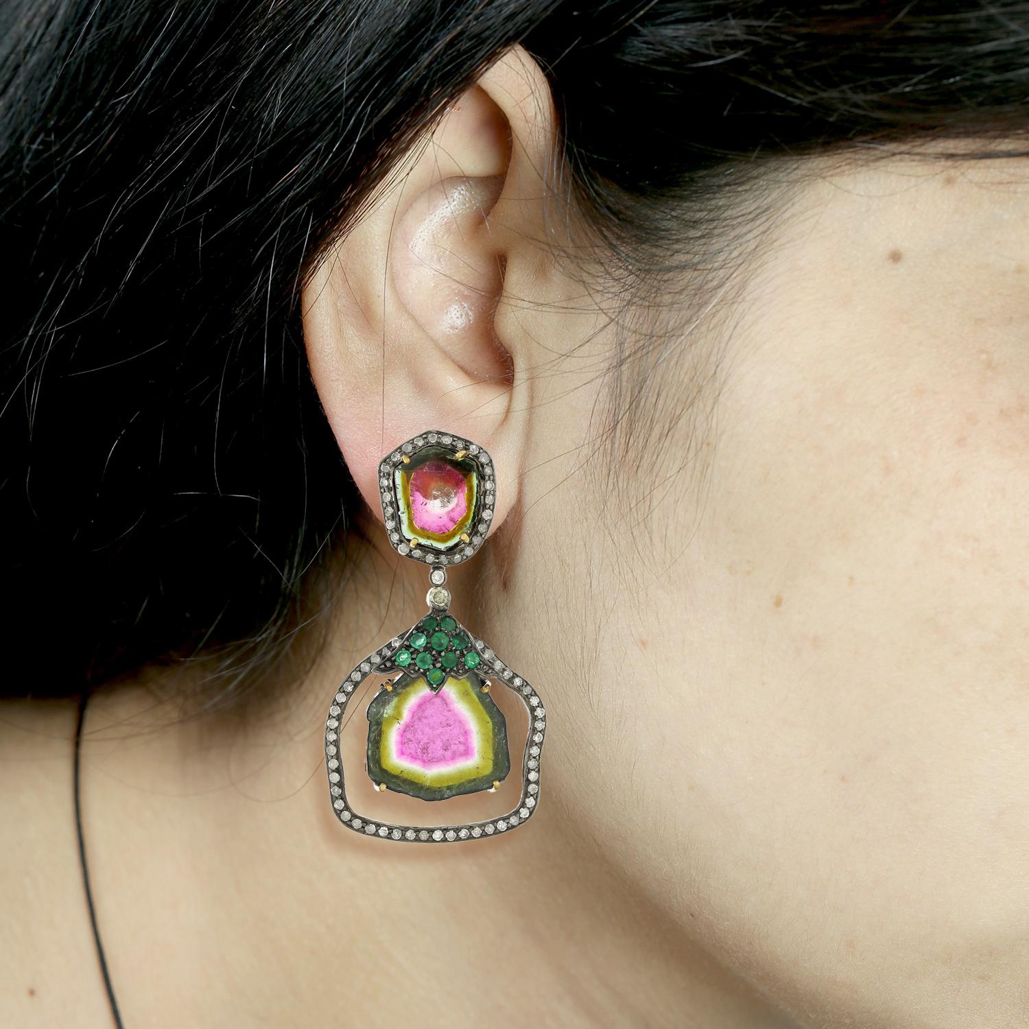 The watermelon tourmaline gemstones have a stunning pink and green color that is reminiscent of the fruit they are named after. The emerald gemstones add a rich, vibrant green color to the earrings, while the pave diamonds add a touch of sparkle and