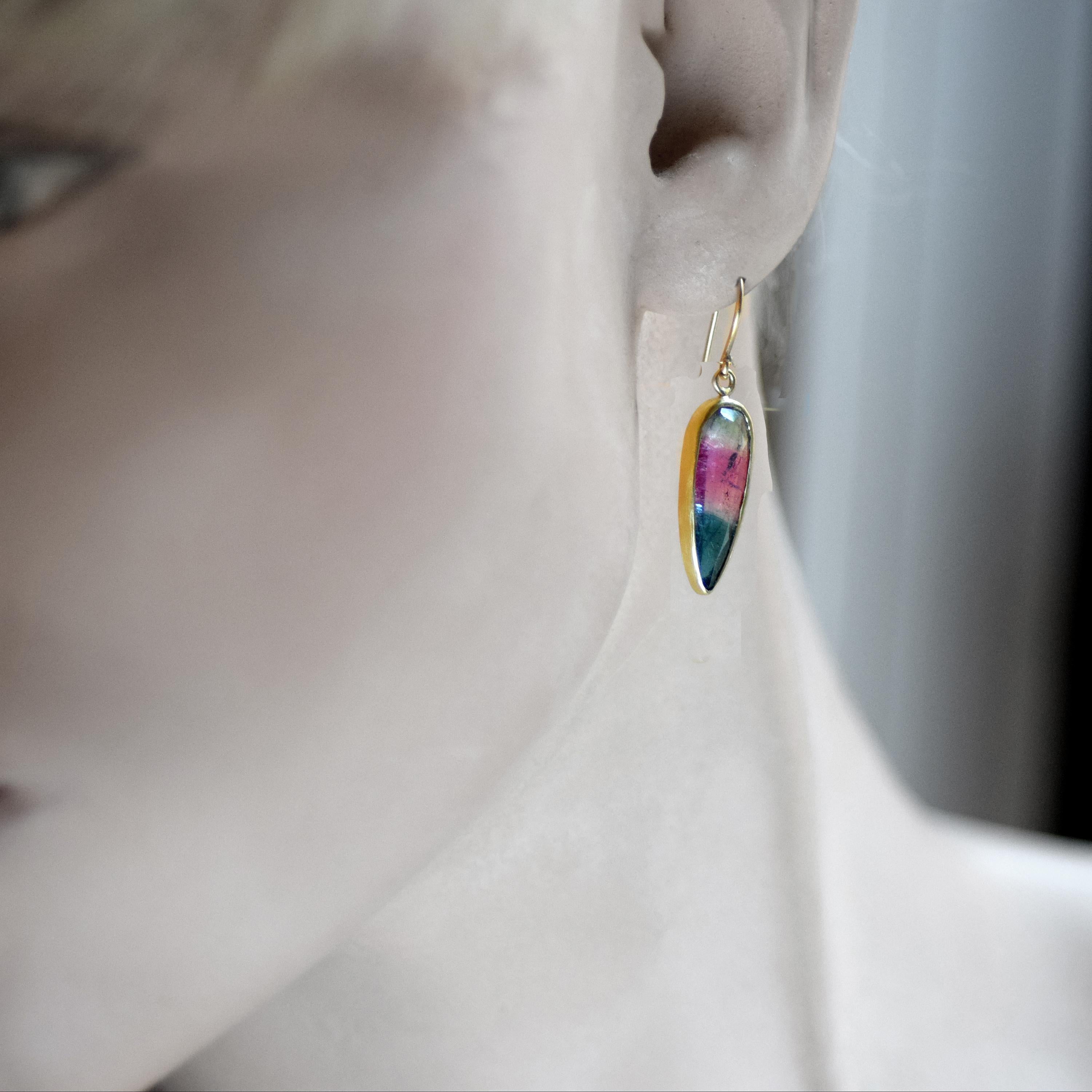 One-of-a-kind 18K gold earrings feature 2 pear shaped faceted watermelon Tourmalines, using my cross bar component.  Hand fabricated using recycled gold.

Measures: 1-3/4