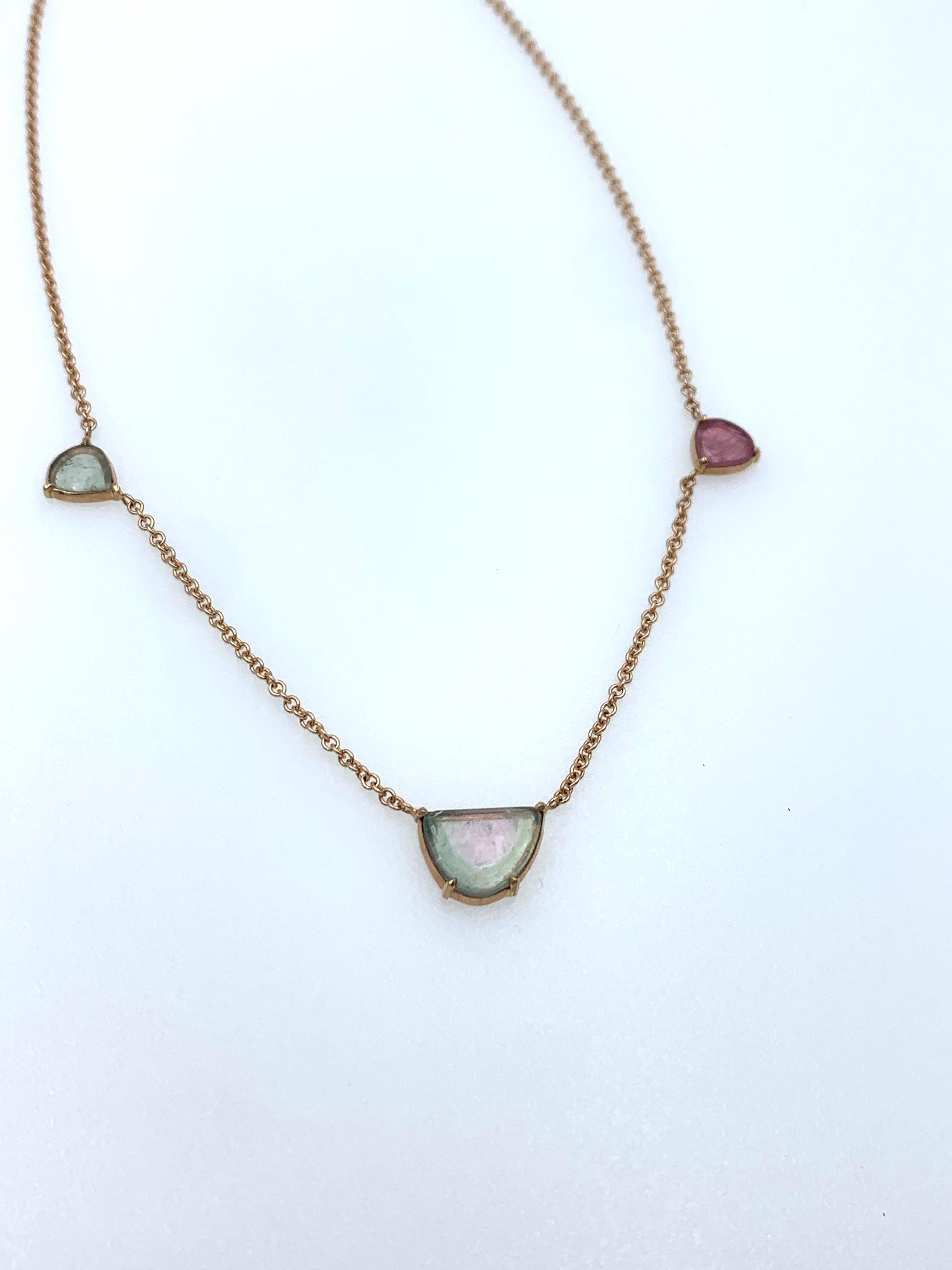 Hand made in 9 karat rose gold with a Watermelon Tourmaline centre stone and two additional Tourmaline slices to each side, one in green and one in pink. The idea behind these designs are that you can layer the necklaces without loosing site of all