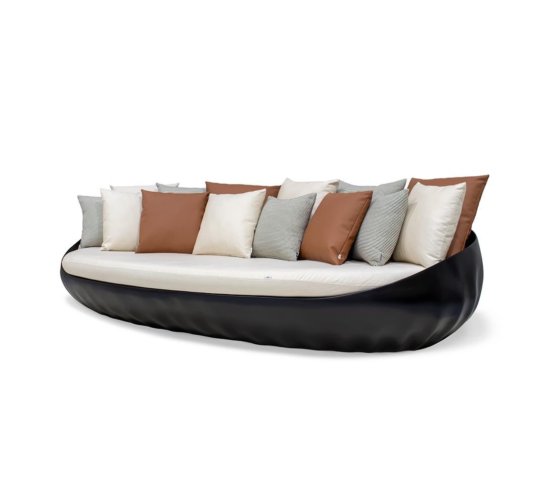 Pearl Outdoor Sofa

The whole design of this contemporary outdoor sofa was developed according to the following structure: 
-	Shell structure: Black matte fiberglass; 
-	Upholstery: Black Acrylic fabric;
-	Pillows: Leather and Dedar Fabrics;

All
