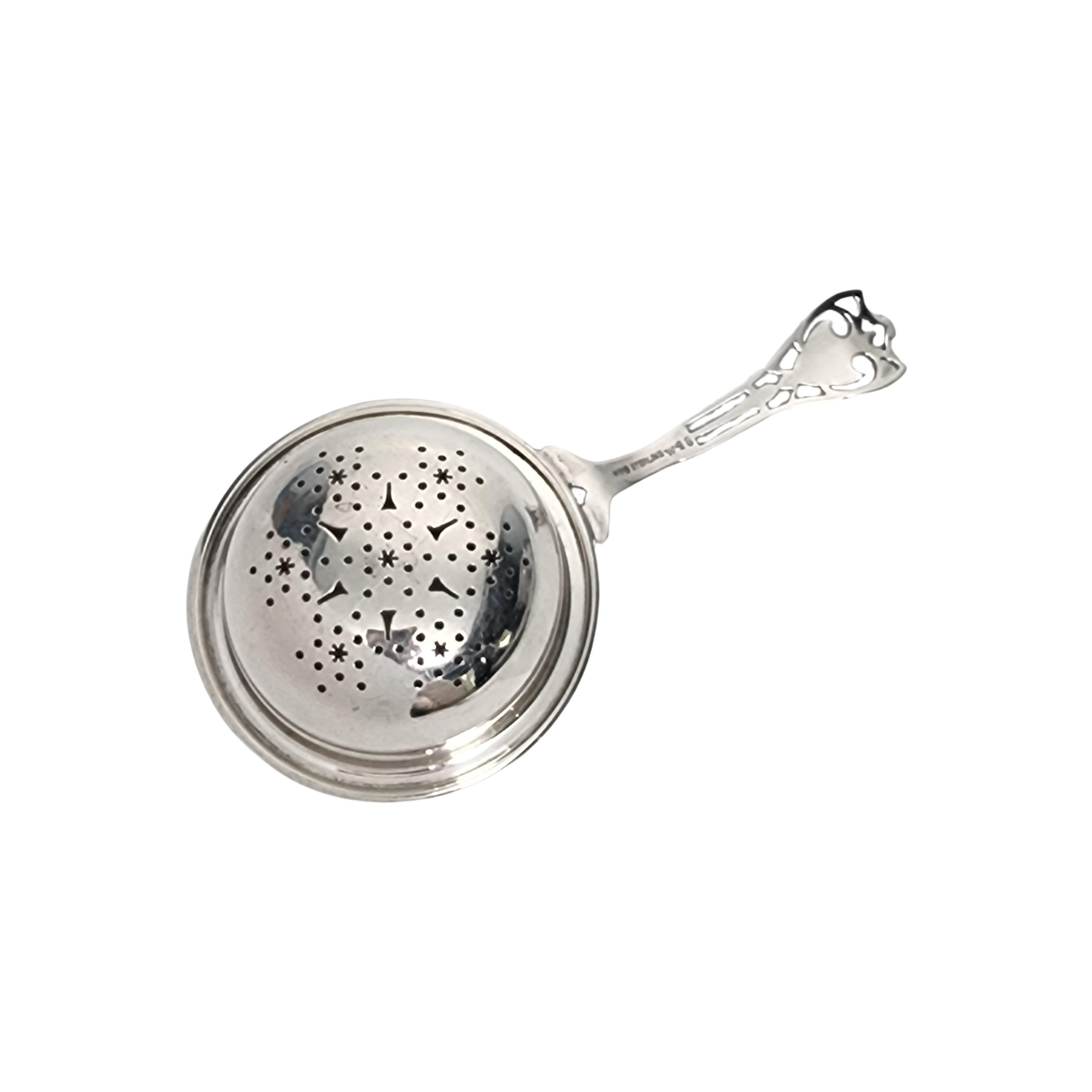 Vintage sterling silver tea strainer in the Putnam pattern by Watson #48.

Watson was active from 1880-1955 specializing in souvenir spoons, vanity and novelty items. This tea strainer features an open work design handle in the Putnam pattern, and a
