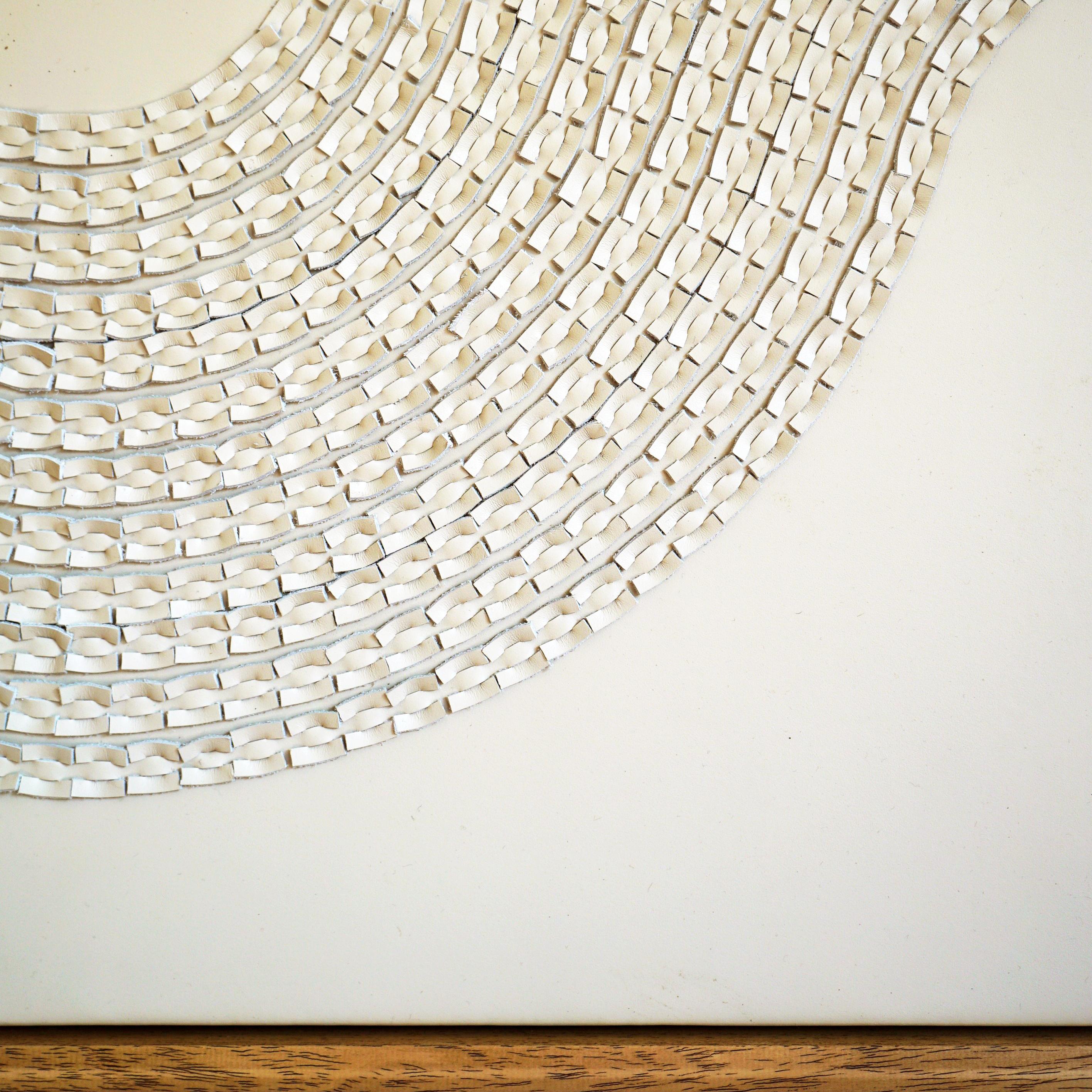 Wave:

A piece of 3D sculptural wall art designed and made from two layers of cream leather, woven together by Louise Heighes.
Measurements are 29 x 45 inches or 114 x 74 cm.

This piece has been inspired by basket weaving.
I love the way a