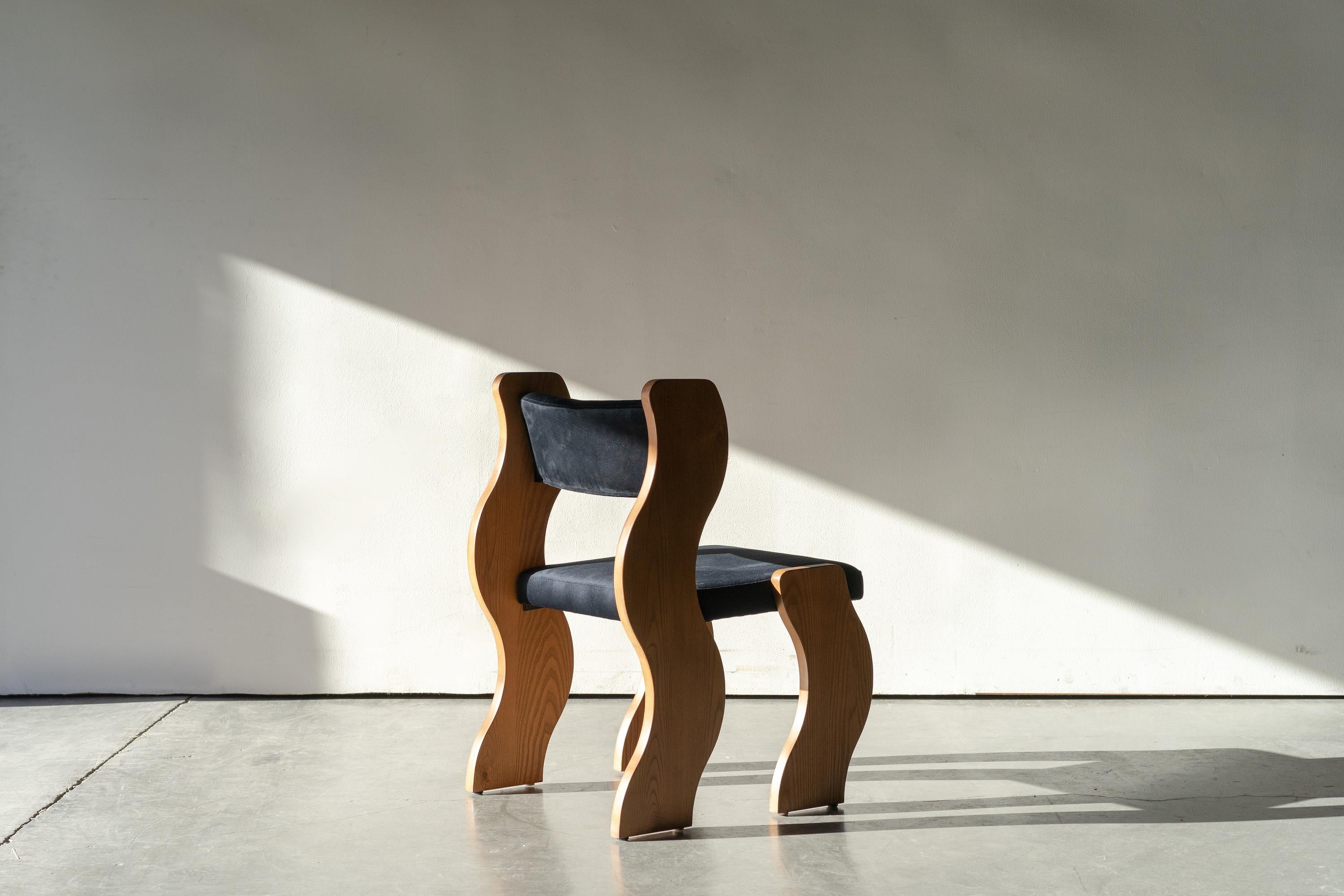 Sometimes a piece evolves from a place you don’t expect. That’s the story of the Wave chair: designed around the Wave Shelf motif, which itself was born from the ashes of a curved low stand. Sometimes a piece takes many iterations and dozens of
