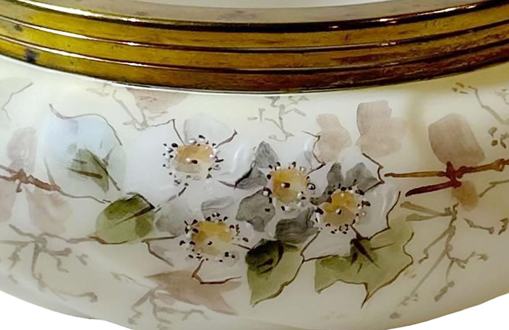 Antique circa 1900 Wave Crest bowl with brass rim. The bowl is decorated beautifully with flowers. Manufactured by the Pairpoint Manufacturing Company, New Bedford, Massachusetts.