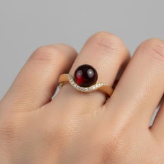 Wave Design Garnet and Topaz Ring in silver, gold
