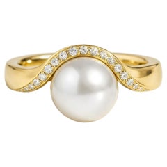 Wave Design White Freshwater Pearl and Topaz Ring in silver, gold