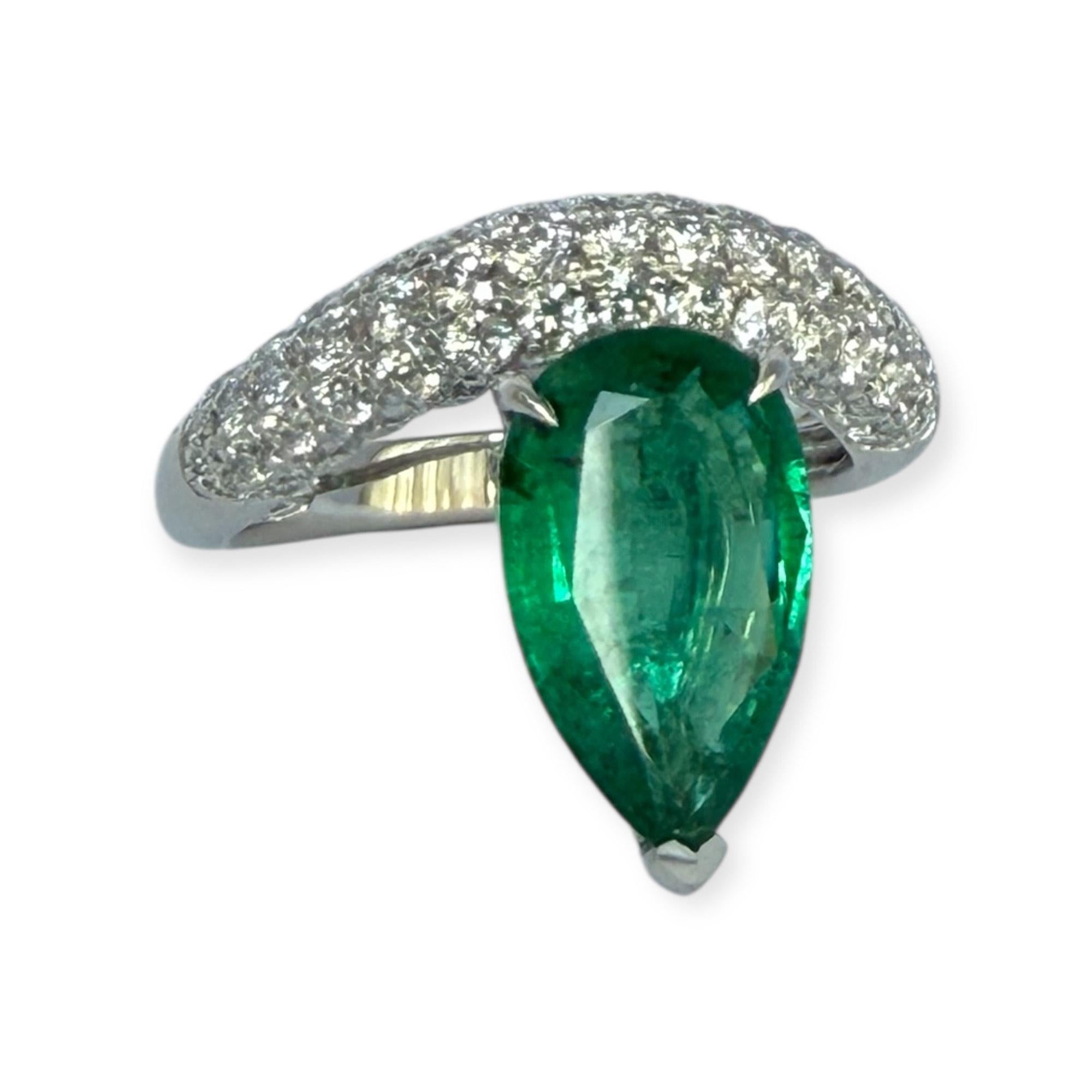 Wave ear climbers with pear shaped emeralds and brilliant cut diamonds In New Condition For Sale In Houston, TX