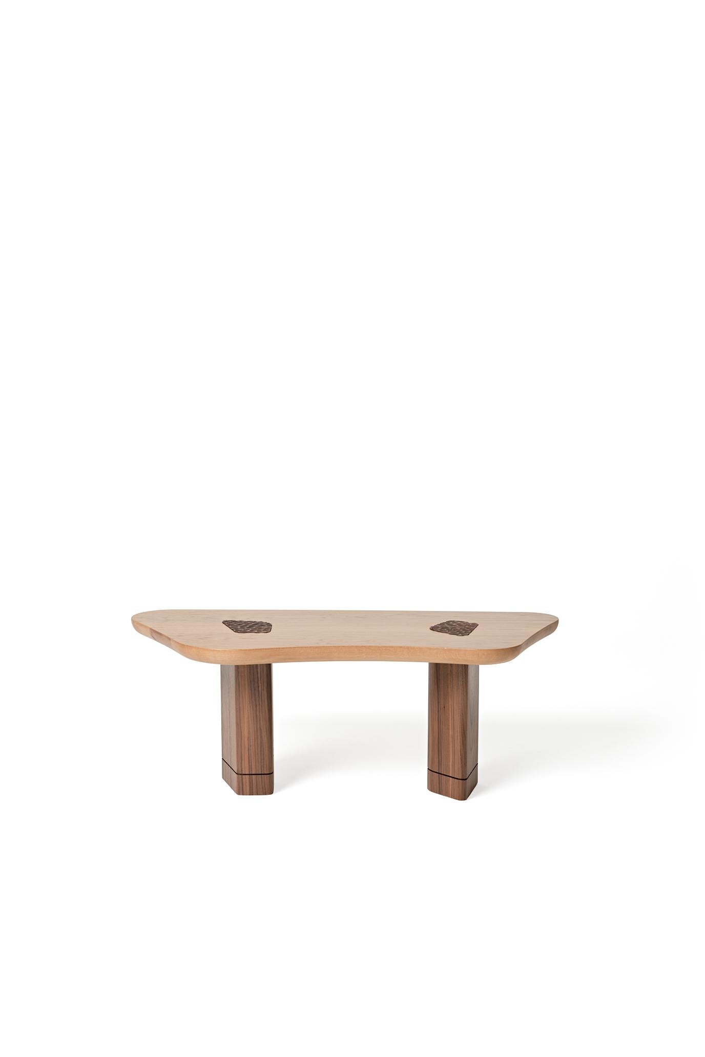 Wave, specially designed for the Circle Form collection by Basic and Bold, is a coffee table inspired by the movement of water. It combines an oak tabletop with innovative and locally handcarved walnut legs. This unique piece brings together the