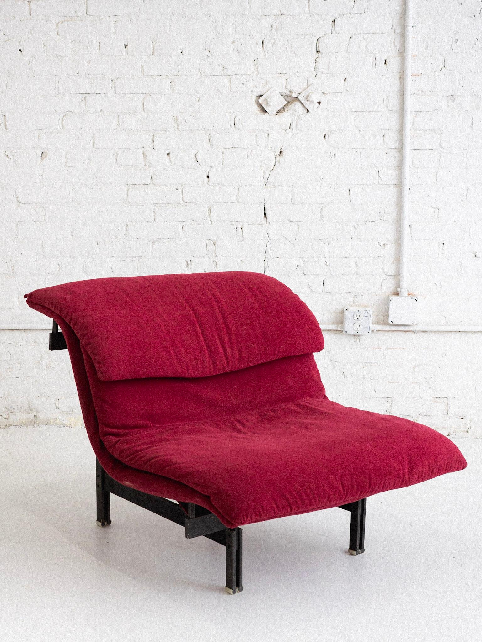 A “Wave” lounge chair by Giovanni Offredi for Saporiti. Heavy textured metal base supports a wave form upholstered seat. Original red textured upholstery. 2 chairs and 1 ottoman available, all sold separately. Sourced in Northern Italy.
