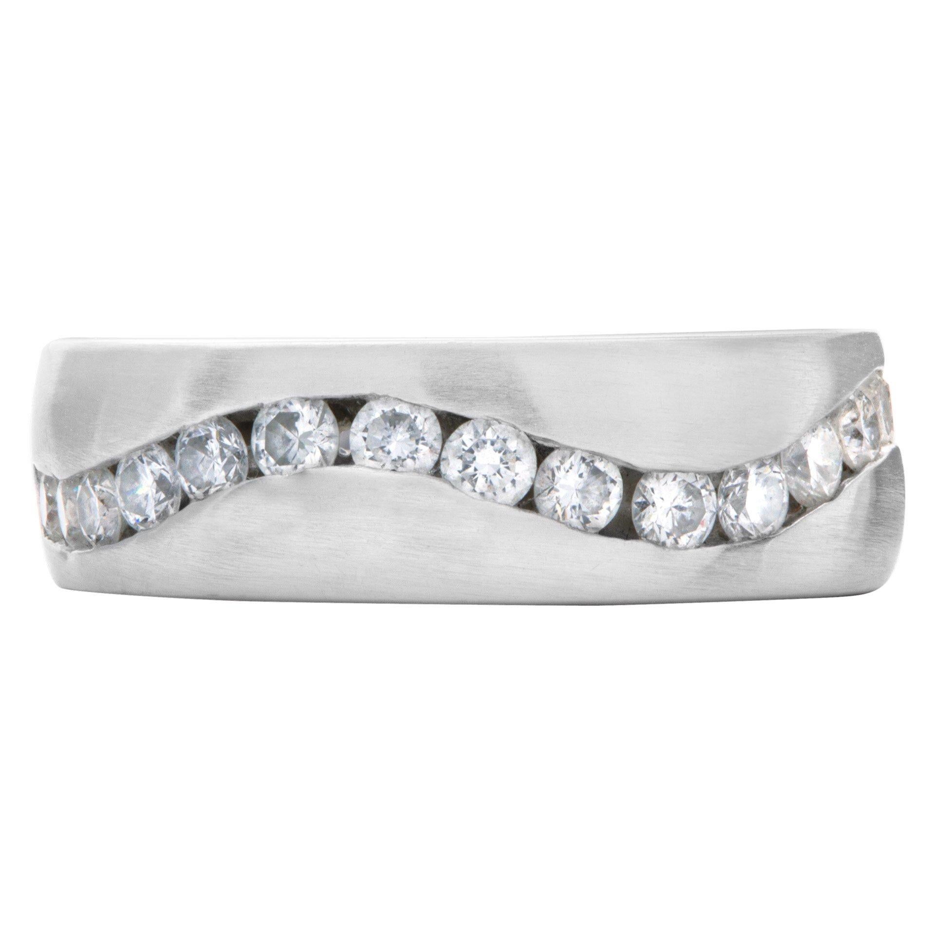 Wave of channel set diamonds wedding band in 14k white gold. Approximately 0.75 carat in diamonds. 7mm width. Ring size 9.

This Diamond ring is currently size 9 and some items can be sized up or down, please ask! It weighs 6.4 pennyweights and is