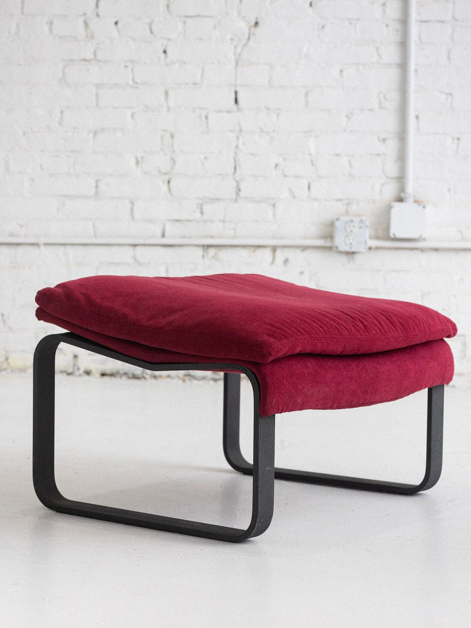 A “Wave” ottoman by Giovanni Offredi for Saporiti. Heavy textured metal base supports a wave form upholstered footrest. Original red textured upholstery. 2 chairs and 1 ottoman available, all sold separately. Sourced in Northern Italy.