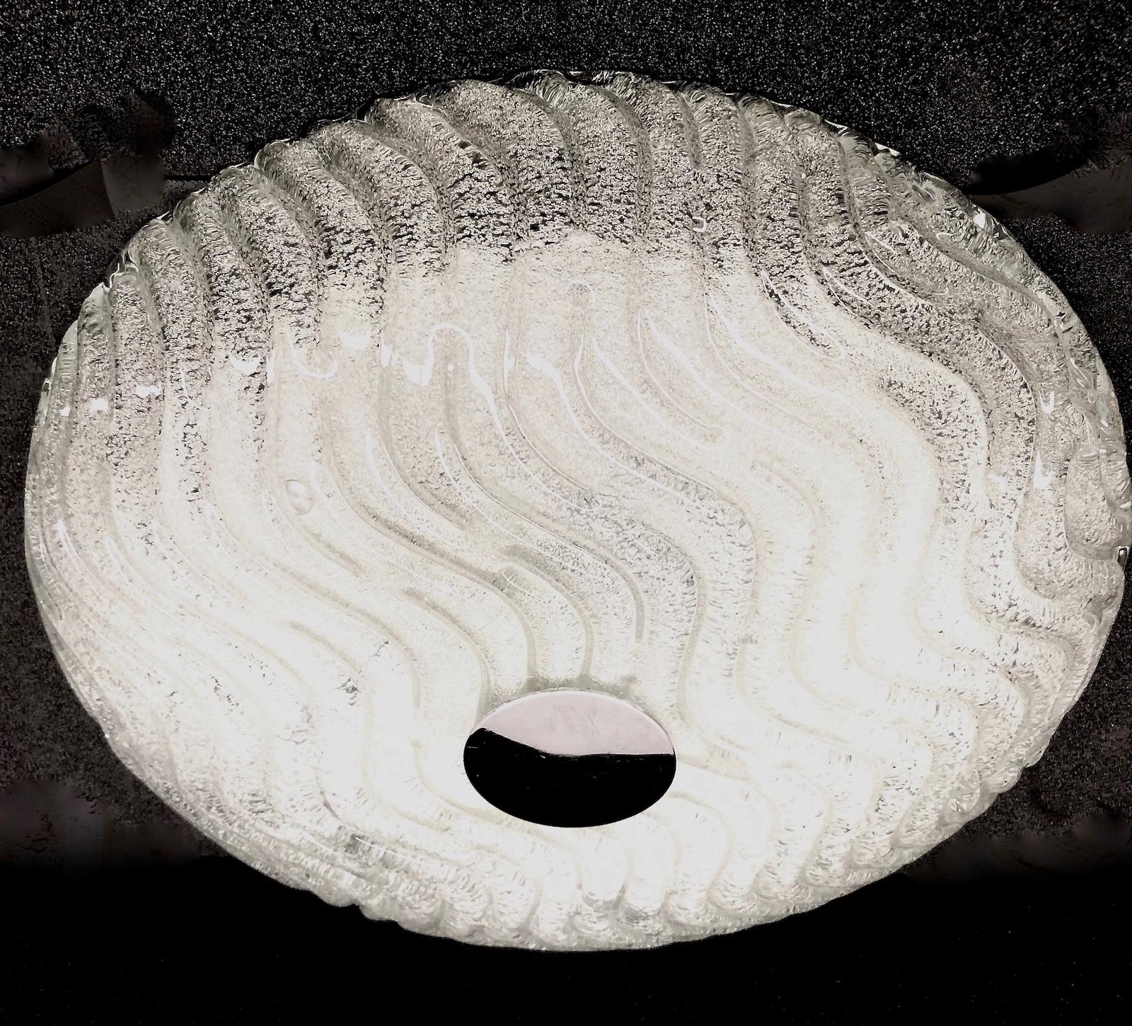 Beautiful wave pattern flush mount. Gorgeous heavy textured Murano glass flush mount with metal fixture. The Murano glass is fixed with a chrome screw on the metal fixture. The flush mount requires three European E27 Edison or Medium bulbs up to 40