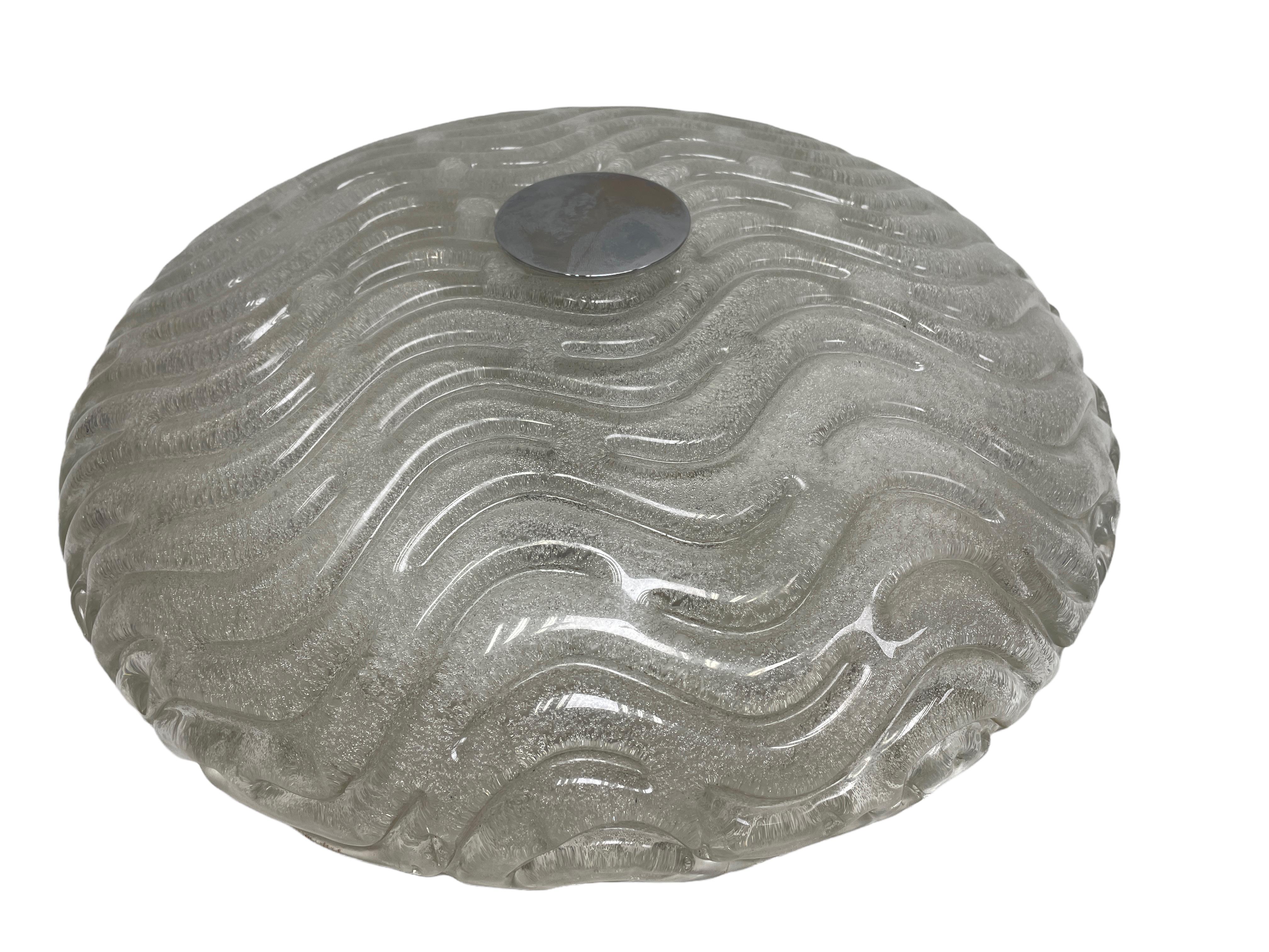 Beautiful wave pattern flush mount. Gorgeous heavy textured Murano glass flush mount with metal fixture. The Murano glass is fixed with a chrome screw on the metal fixture. The Fixture requires three European E14 / 110 Volt Candelabra bulbs, each
