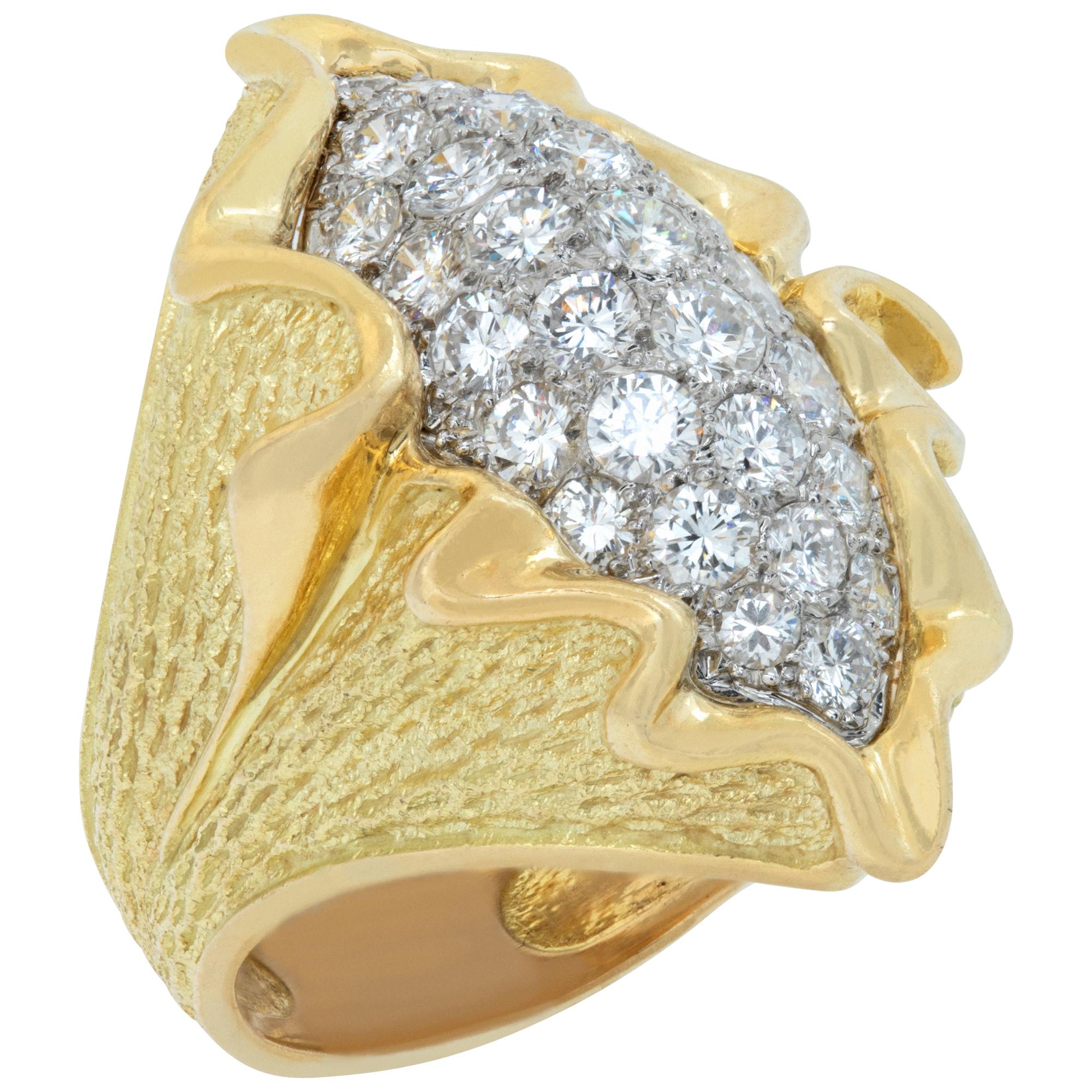 Wave ring with round brilliant cut diamonds set in yellow and white gold. In Excellent Condition For Sale In Surfside, FL