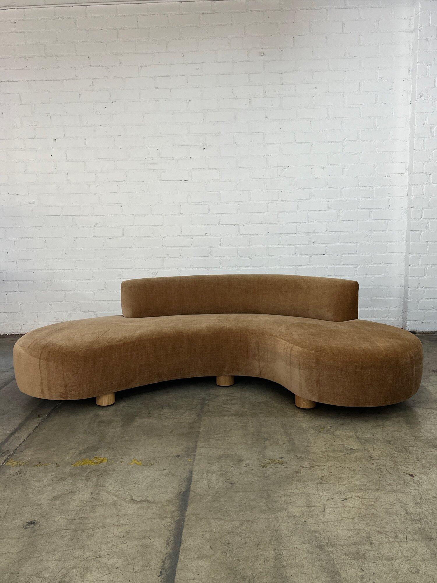W100 D37 H25 SW100 SD33 SH16

Handcrafted Wave sofa by Vintage on Point on white oak cylinder legs. Upholstered in Cognac colored chenille.