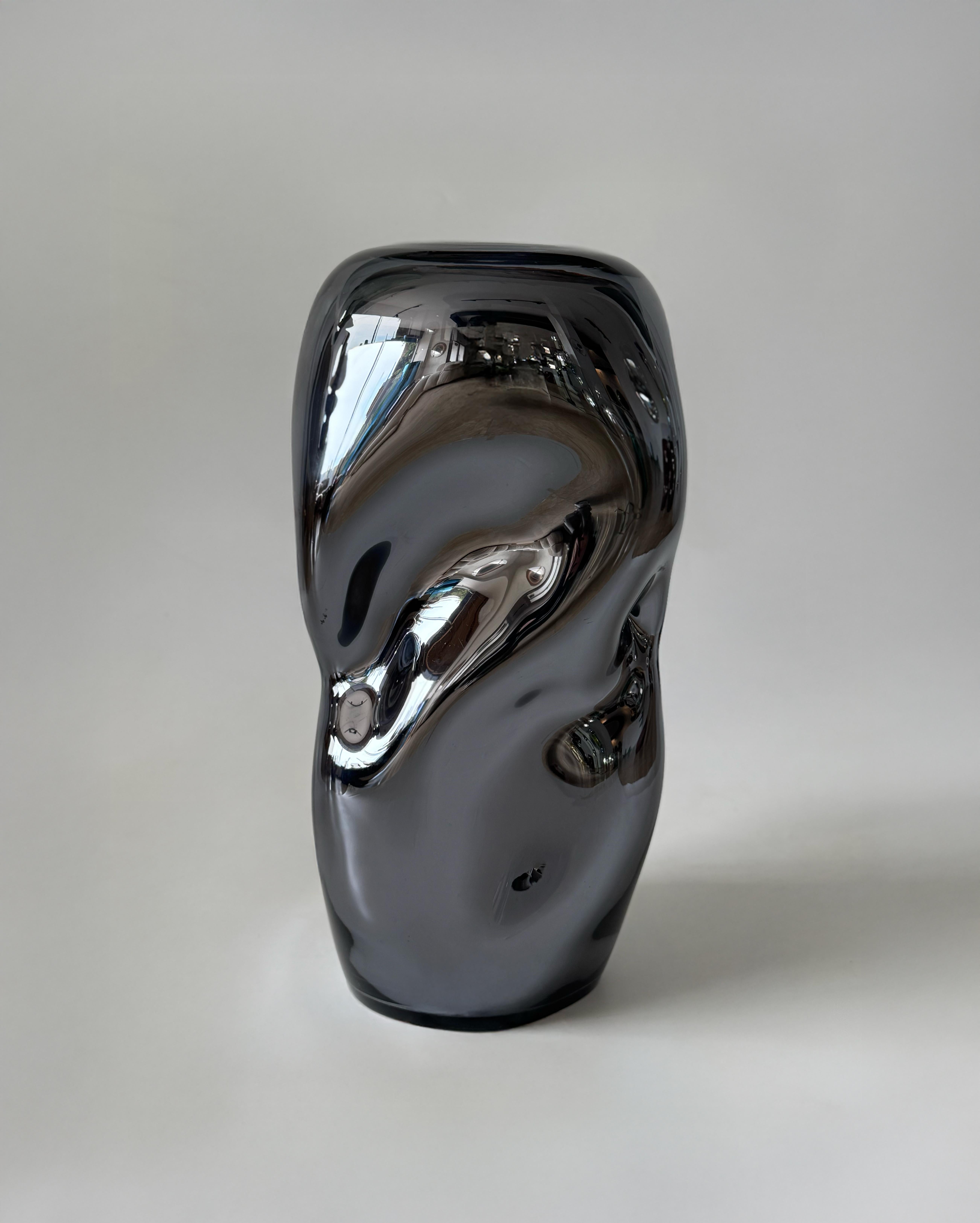 Each Wave Stool / Side Table, crafted with meticulous attention to detail, showcases intriguing shapes. Whether used as a seating option or as a decorative accent, these organically shaped blown-glass stools display a unique approach to their