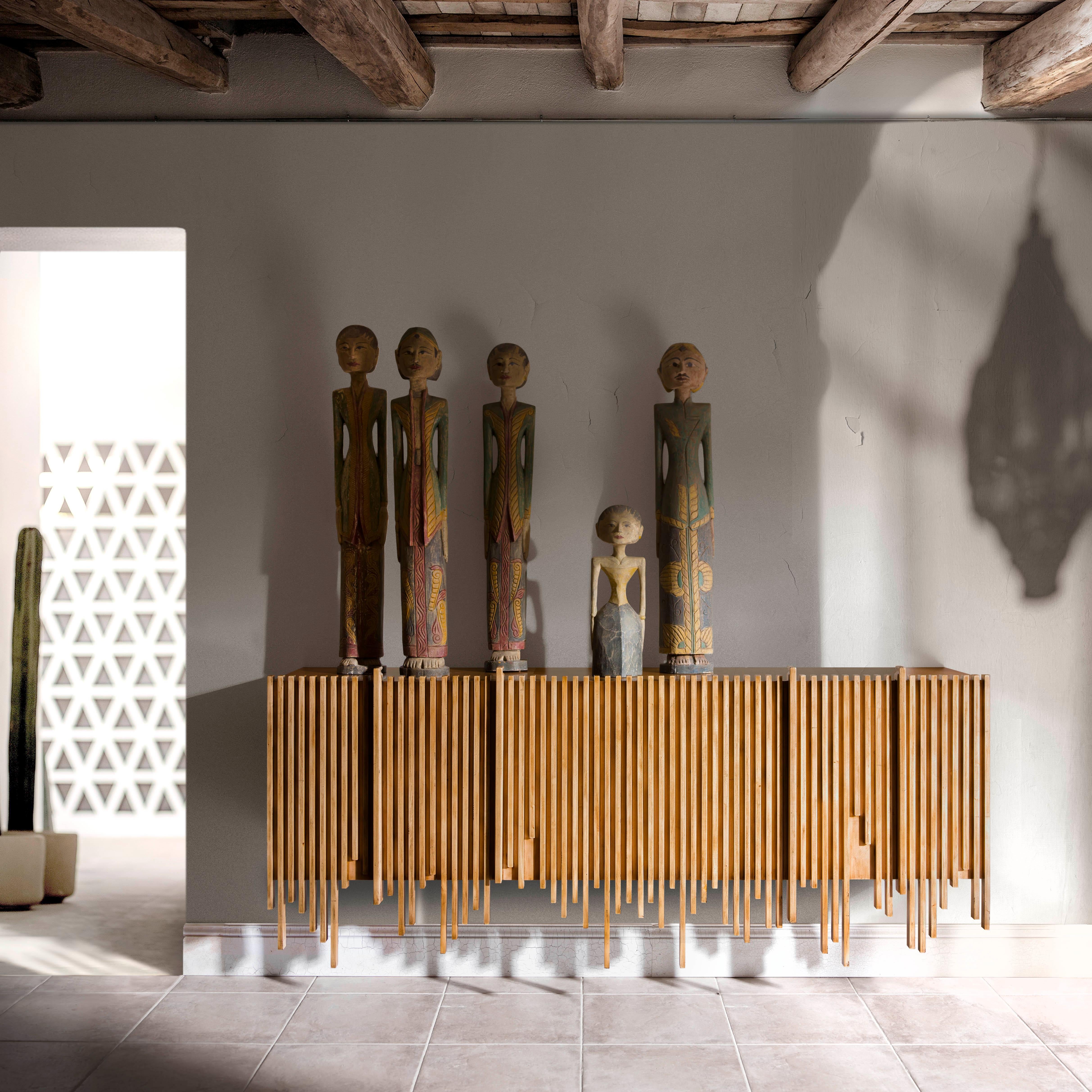 Wave Sideboard by Lola Glamour
Dimensions: D 45 x W 200 x H 57/80 cm
Materials: Wood.

Suspended sideboard that can be crossed by a series of parallel wooden slats. We tried to capture that exact moment when, looking through the window glass, you