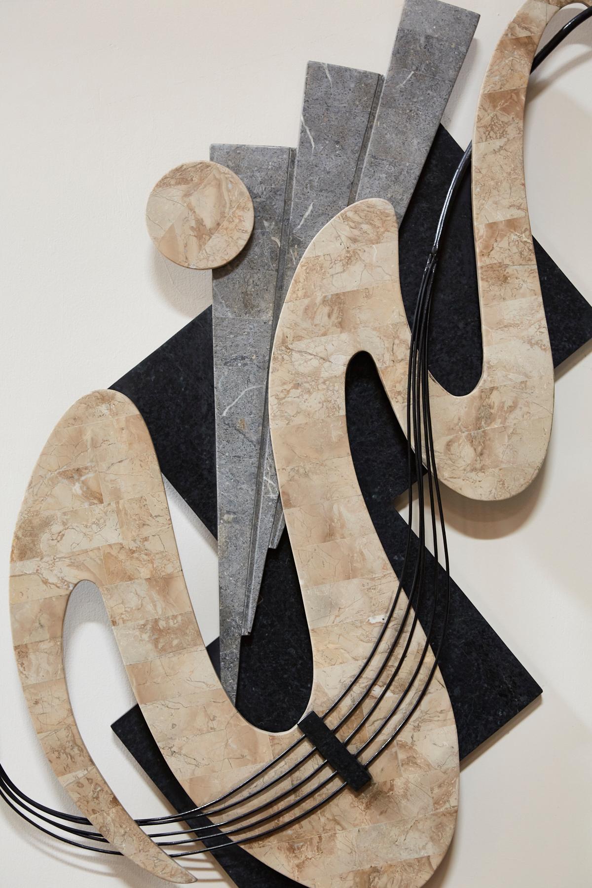 Wave abstract wall sculpture executed in handcut and inlaid tessellated stone, including Black stone, Cantor stone and Gray stone for a neutral color palette. Accented with iron.

All furnishings are made from 100% natural Fossil Stone or Seashell