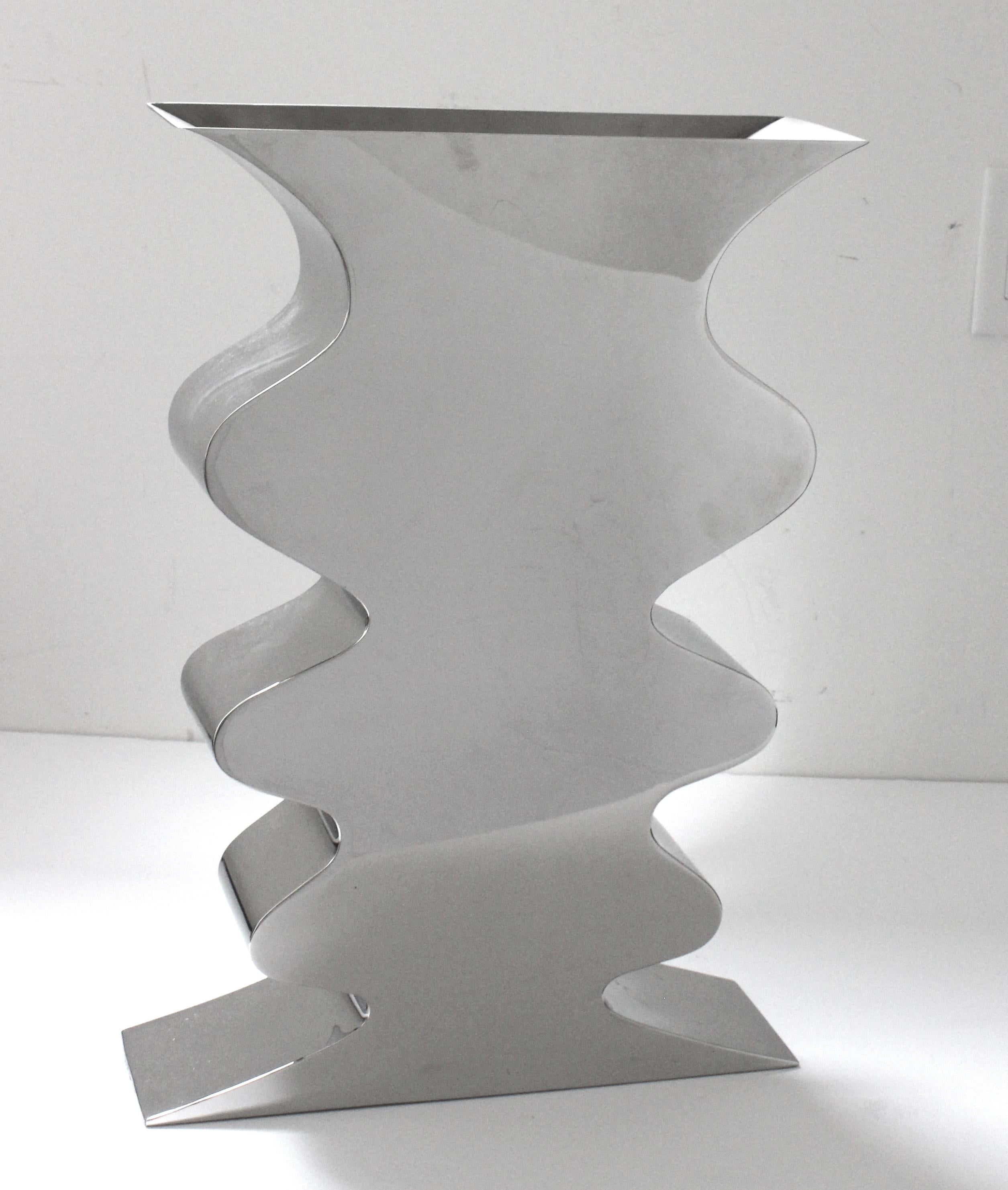This dramatic polished steel piece was created by Stanley J. Freedman in the 1980s and is titled the 