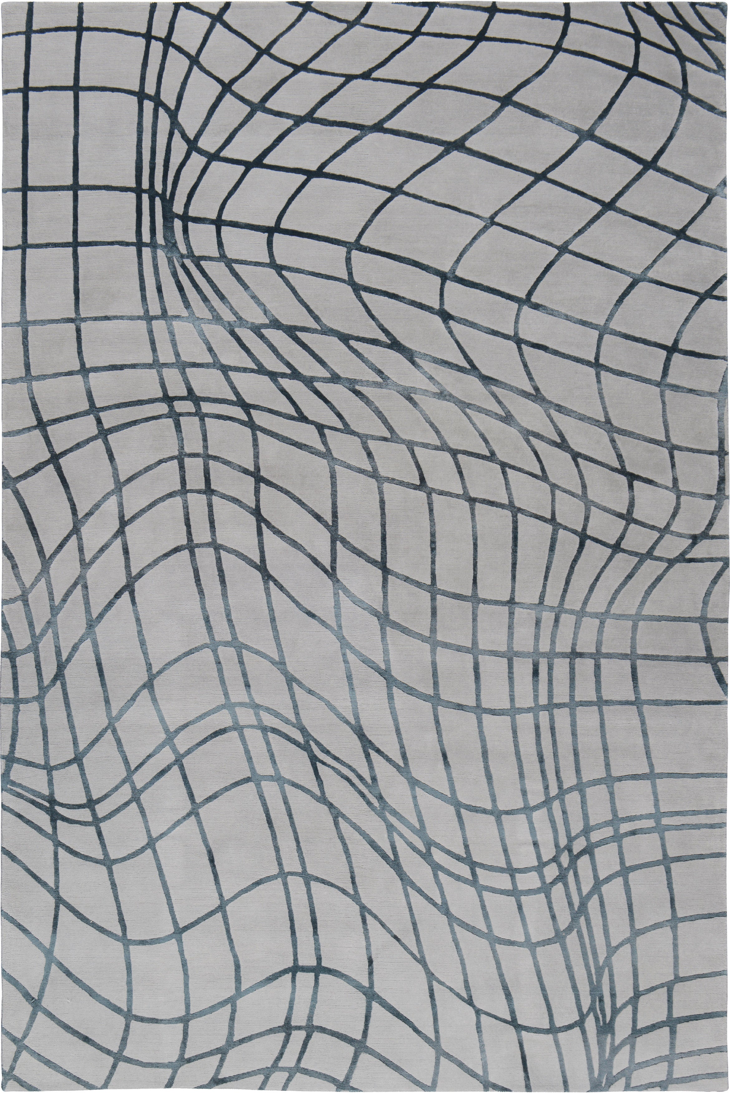 Wavelength features a distorted grid motif inspired by a 3D graph. The rug transforms the abstract lines into a bold motif, perfect for adding intrigue to a space. Woven by our expert craftspeople in Nepal using the finest wool and silk.