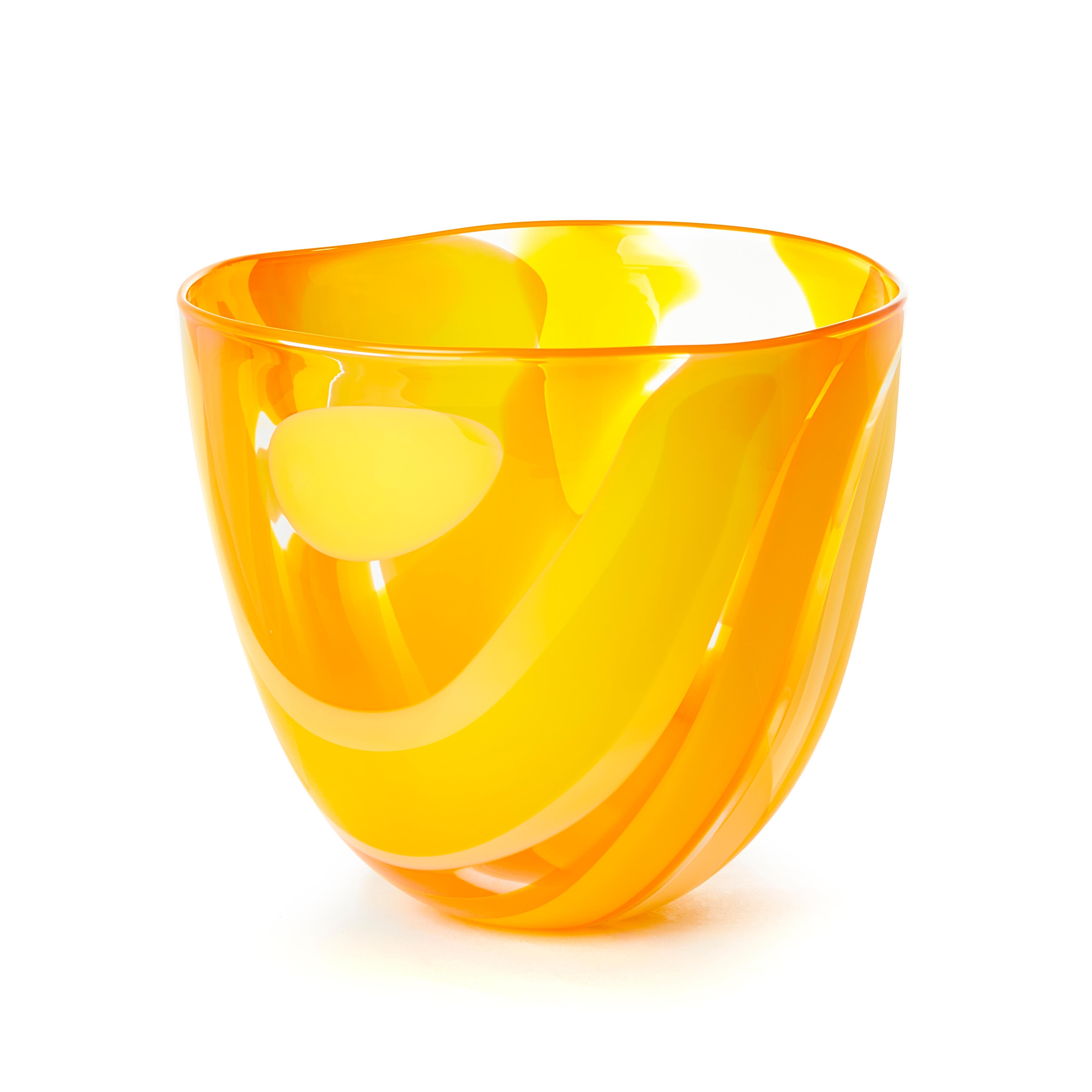 'Waves in yellow and orange' is from a collection of beautifully crafted, unique glass bowls and centerpieces by the British artist Neil Wilkin. Taking a painterly approach, Neil Wilkin merges his colors to create a larger palette of soft hues.