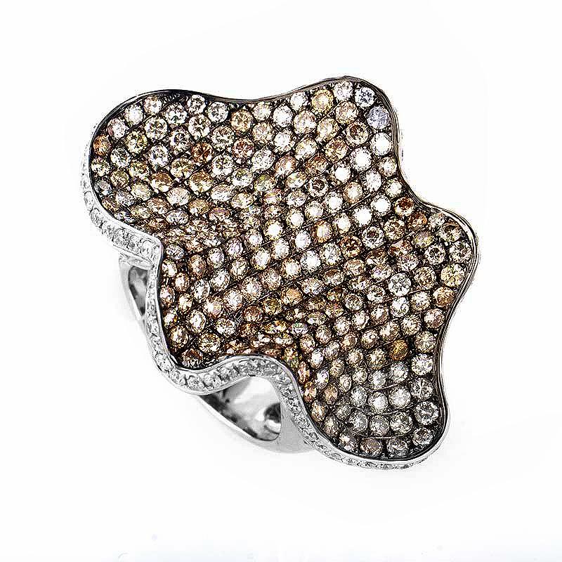 This ring is flashy and fun. It is made of 18K white gold and boasts a brown diamond pave accented with white diamonds totaling at ~5.18ct.
