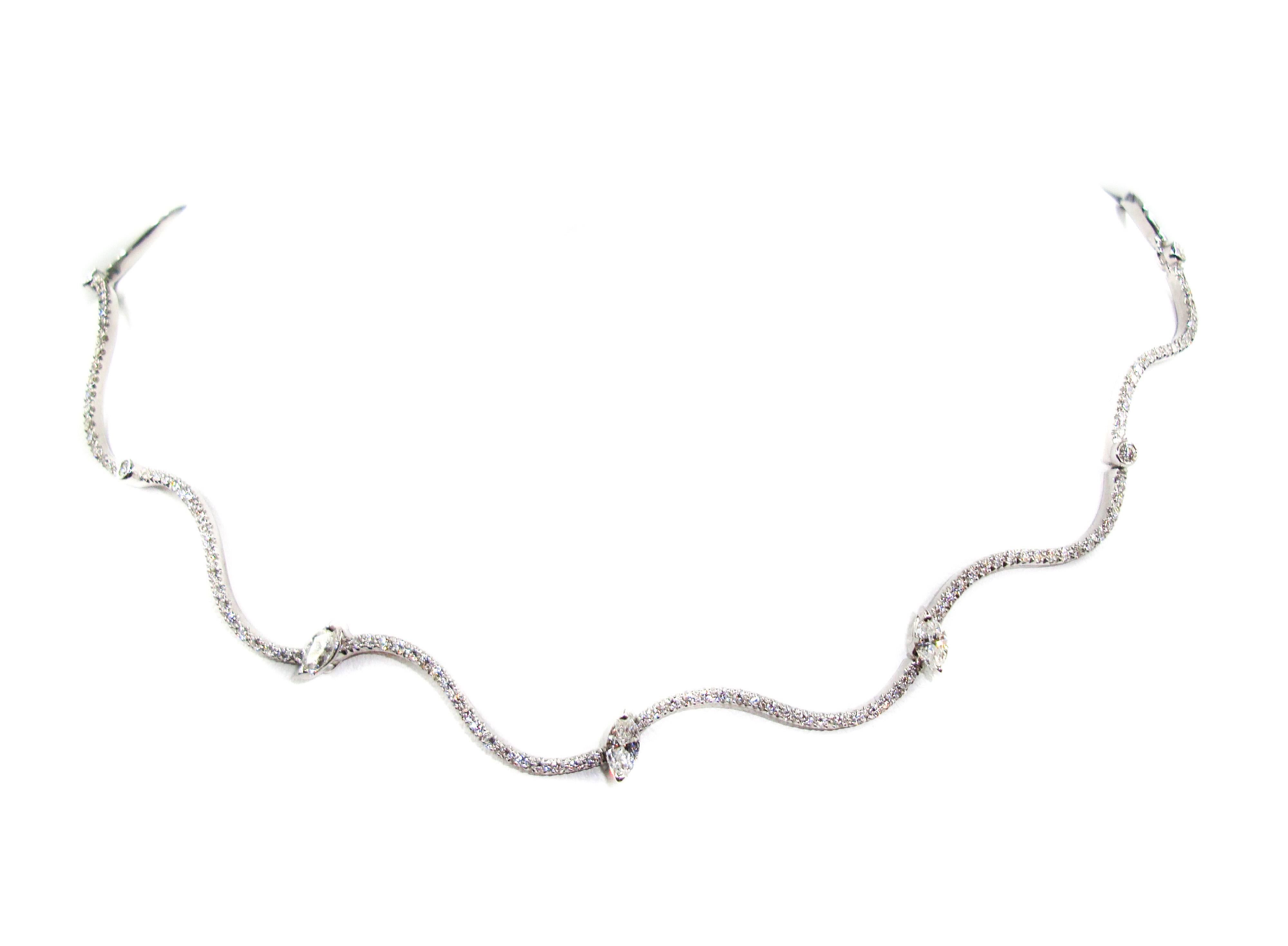 This fine Italian crafted diamond necklace gives a fresh turn to the classic Diamond Necklace set in 18k white gold, features a wavy line of diamonds for an exciting look. 
This necklace features 3 marquise shaped diamonds dispersed at the center,