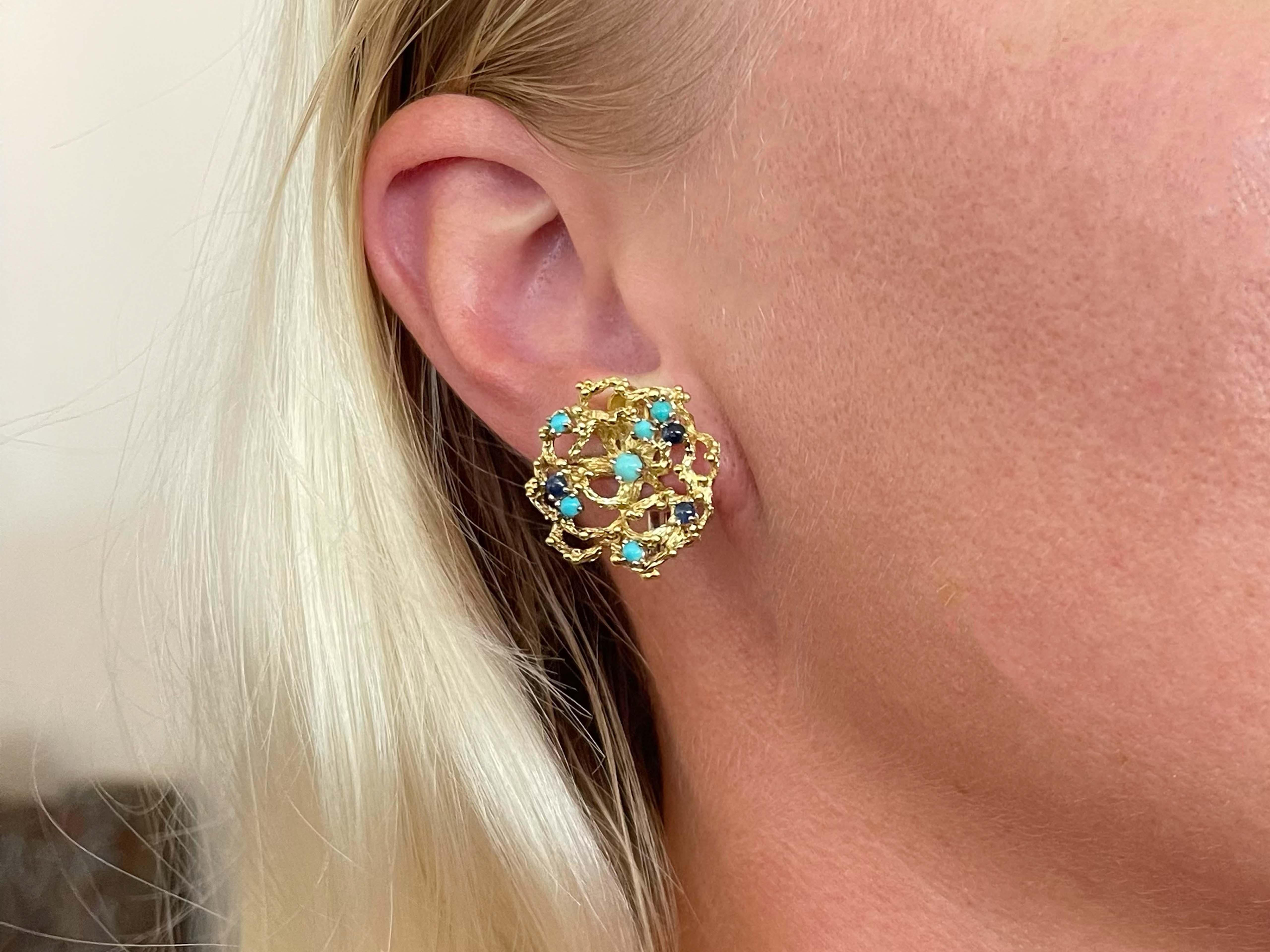 Earrings Specifications:

Metal: 18K Yellow Gold

Total Weight: 12.7 Grams

Gemstone: 6 Sapphire and 12 Turquoise

Earring Measurements: 23.5 mm diameter

Condition: Preowned, Excellent