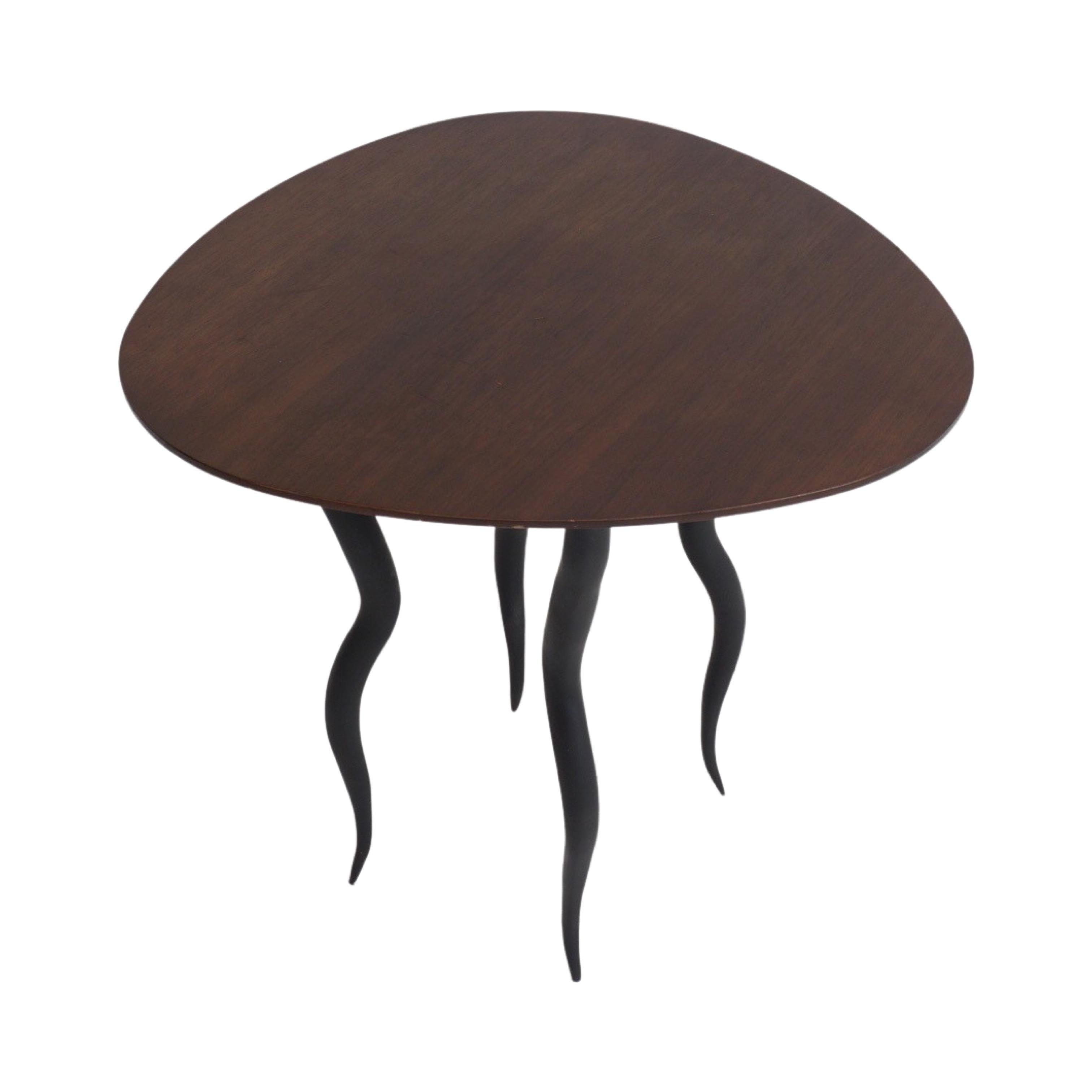 Have you ever seen Louise Bourgeois’s Spider sculptures? Well, this wavy leg table is basically one of those legendary pieces of art reincarnated in table form. This table has a lot of other things in common with spiders. Its design is clever yet