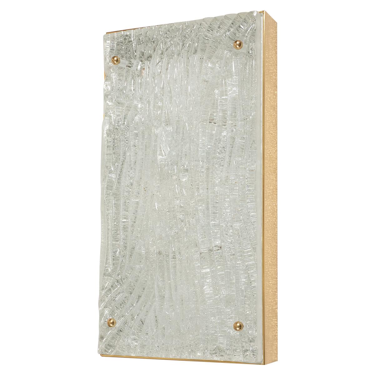Wavy textured glass sconce in rectangular brass frame with ball finial details.