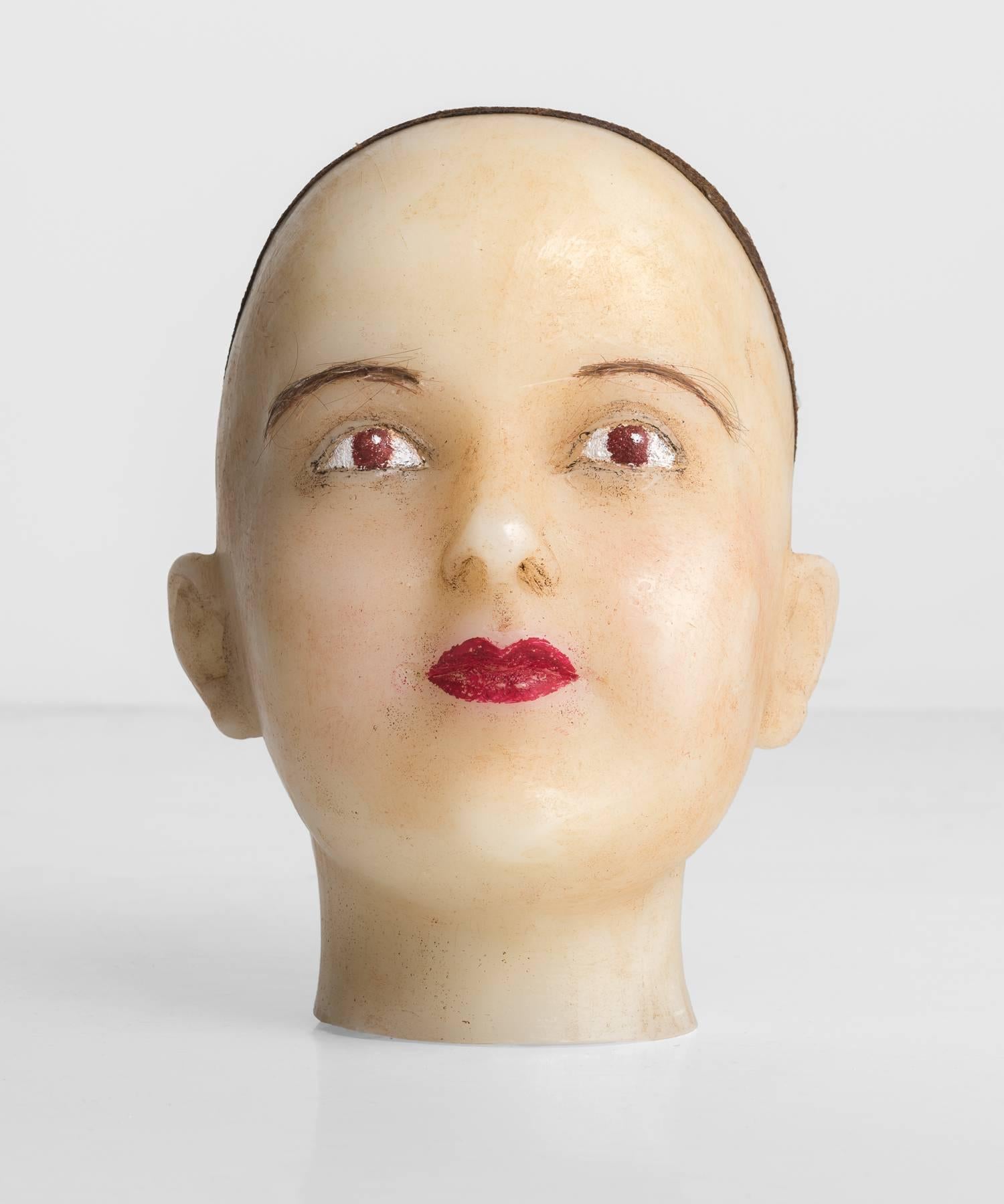 Wax Ladies Head, circa 1940

Ladies head in cast wax with hairnet, hand-painted features and faux hair eyebrows.