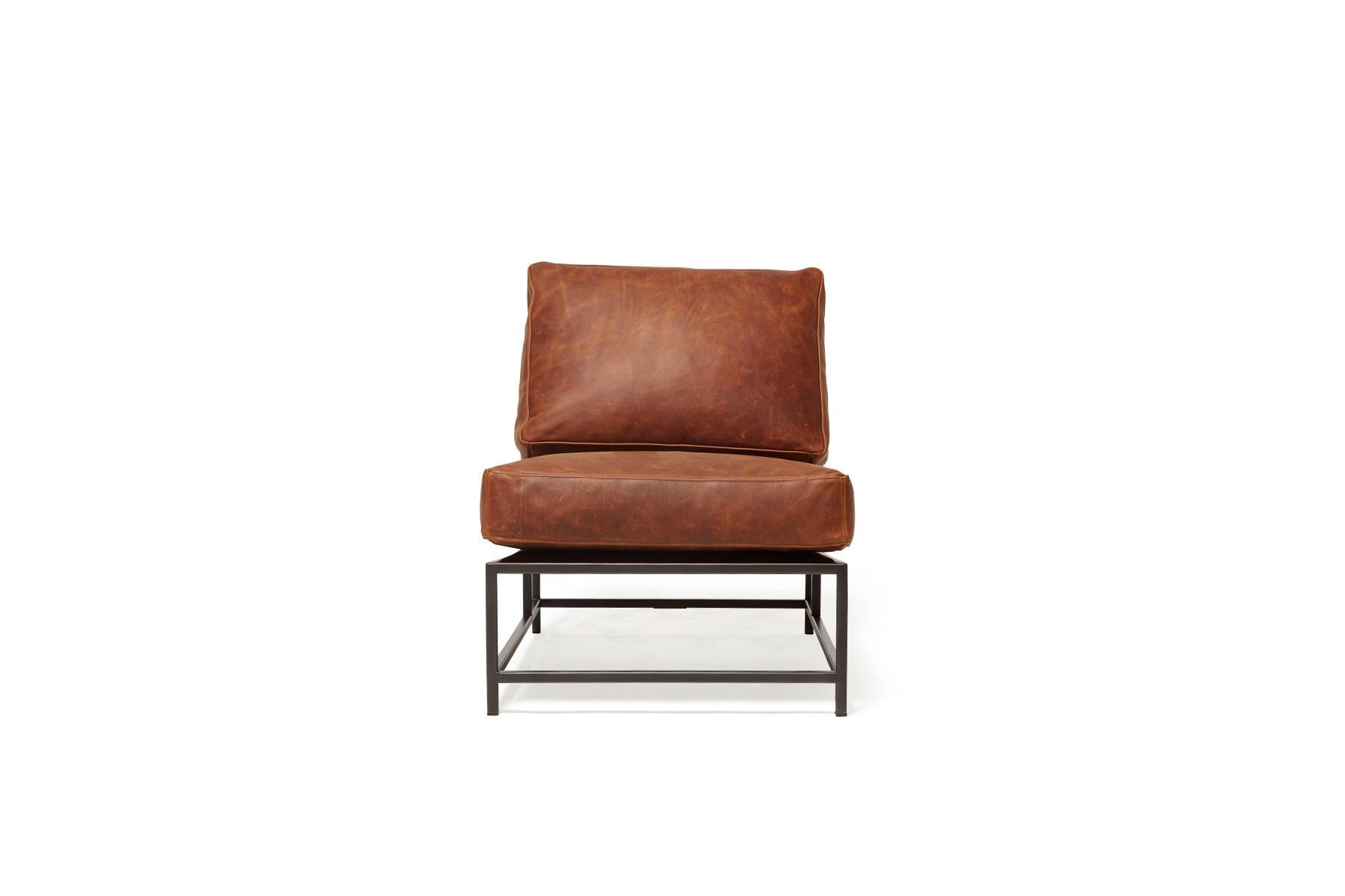 Sleek and refined, the Inheritance Collection Chair by Stephen Kenn is a great addition to nearly any space. 

This variation is upholstered in a beautiful reddish tan waxed leather from the Brentwood collection by Moore & Giles for an effortlessly