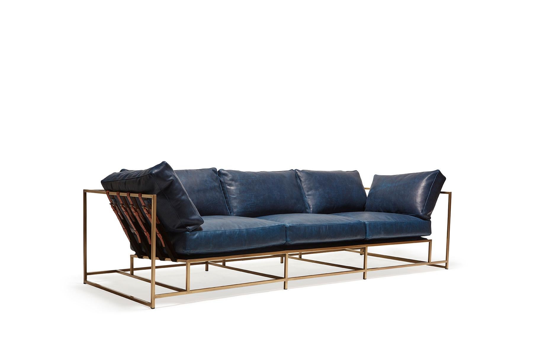 The Inheritance Sofa by Stephen Kenn is as comfortable as it is unique. The design features an exposed construction composed of three elements - a steel frame, plush upholstery, and supportive belts. The deep seating area is perfect for a relaxing