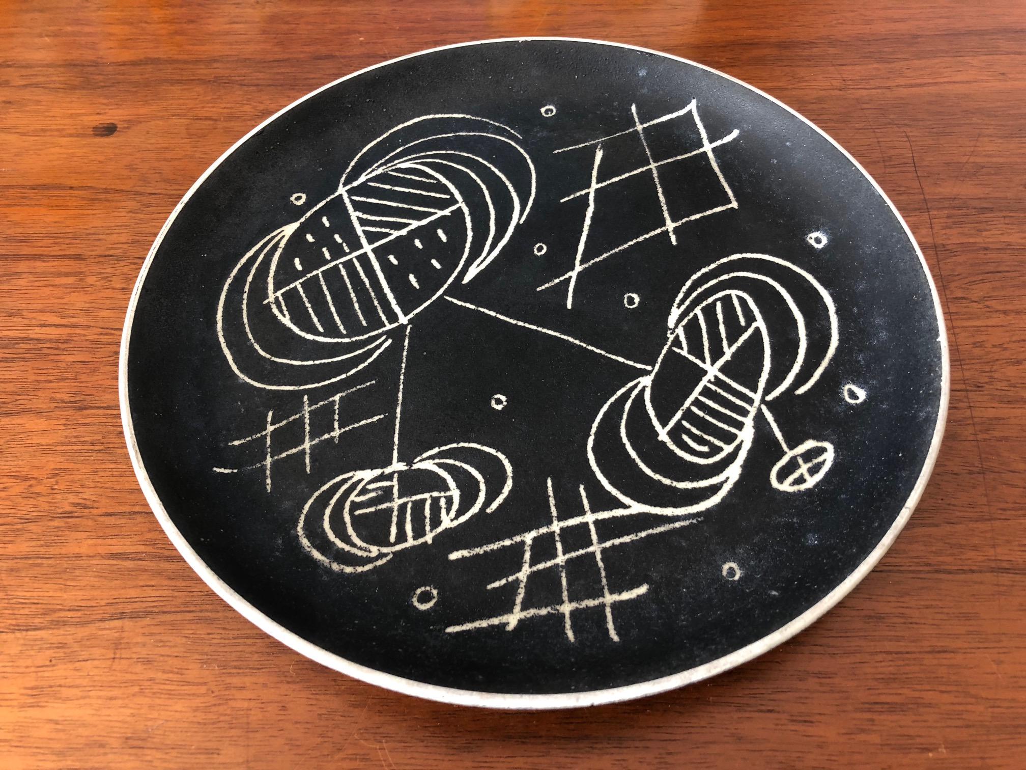 An unusual Waylande Gregory ceramic decorative plate, circa 1950s.