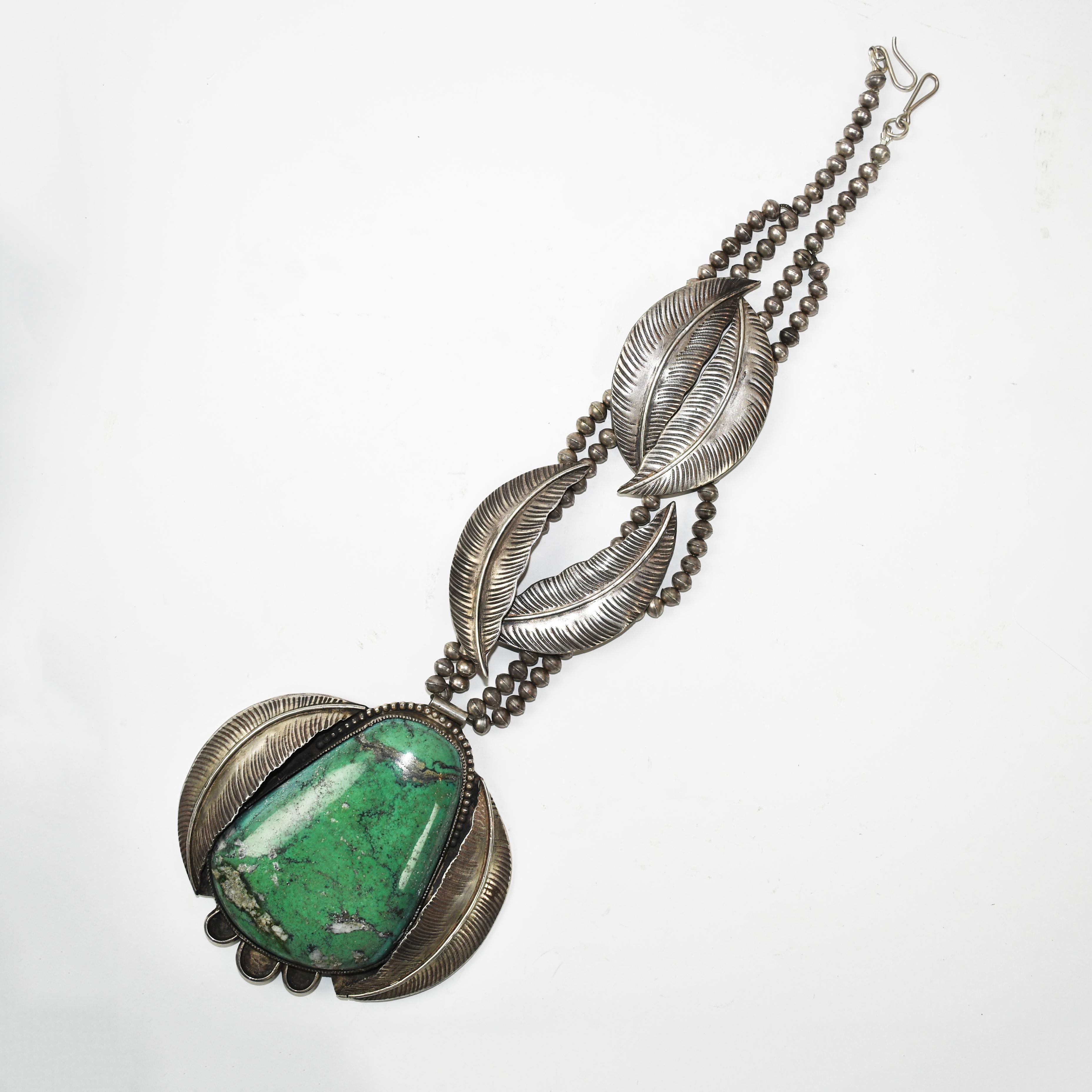 Wayne Aguilar Sterling Silver Large Turquoise Native American Necklace.
The turquoise measures approximately 4.5