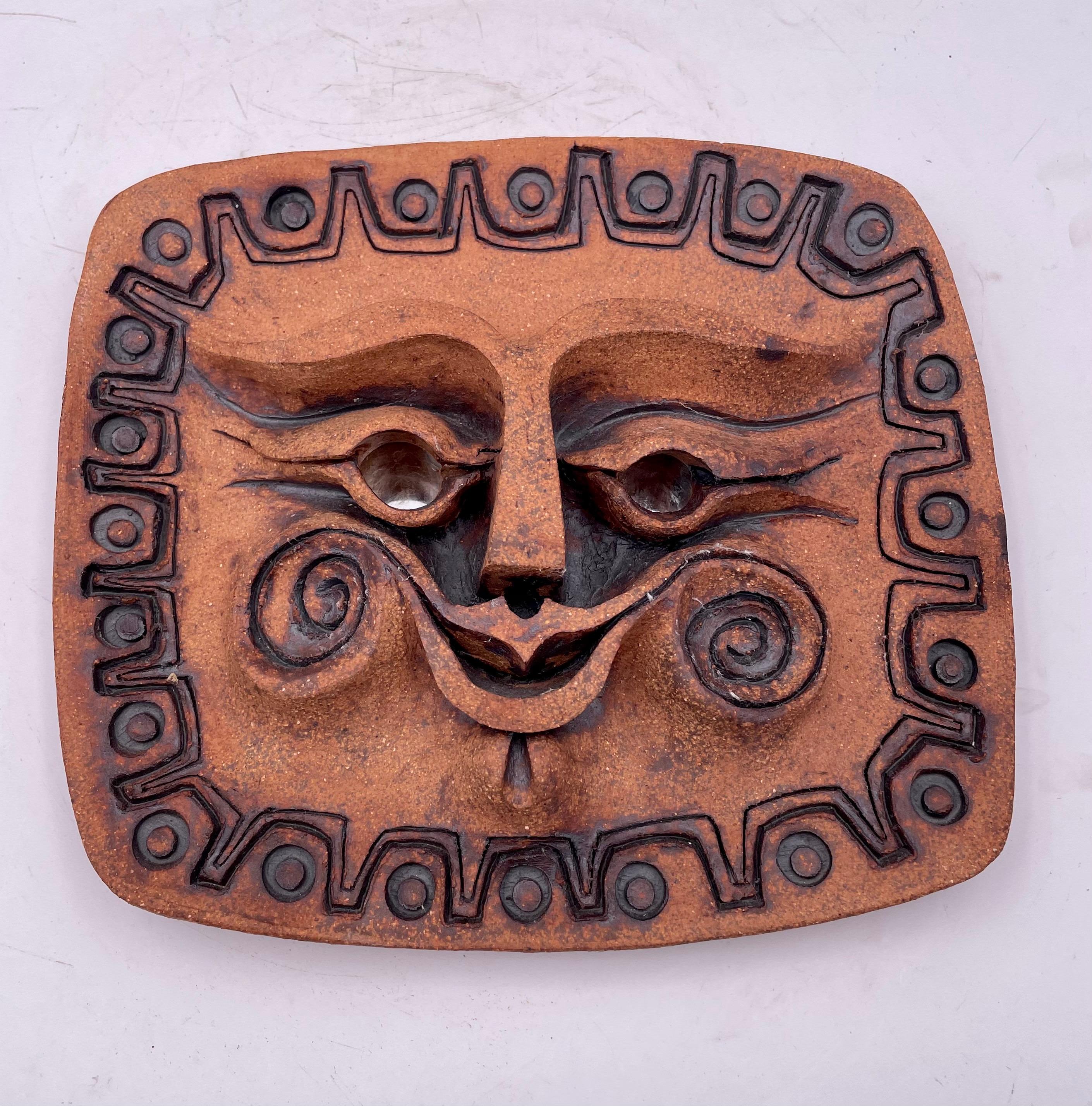 Beautiful wall plaque sculpture of the sun, with mirror eyes, circa 1970's California artist stamped in the back.