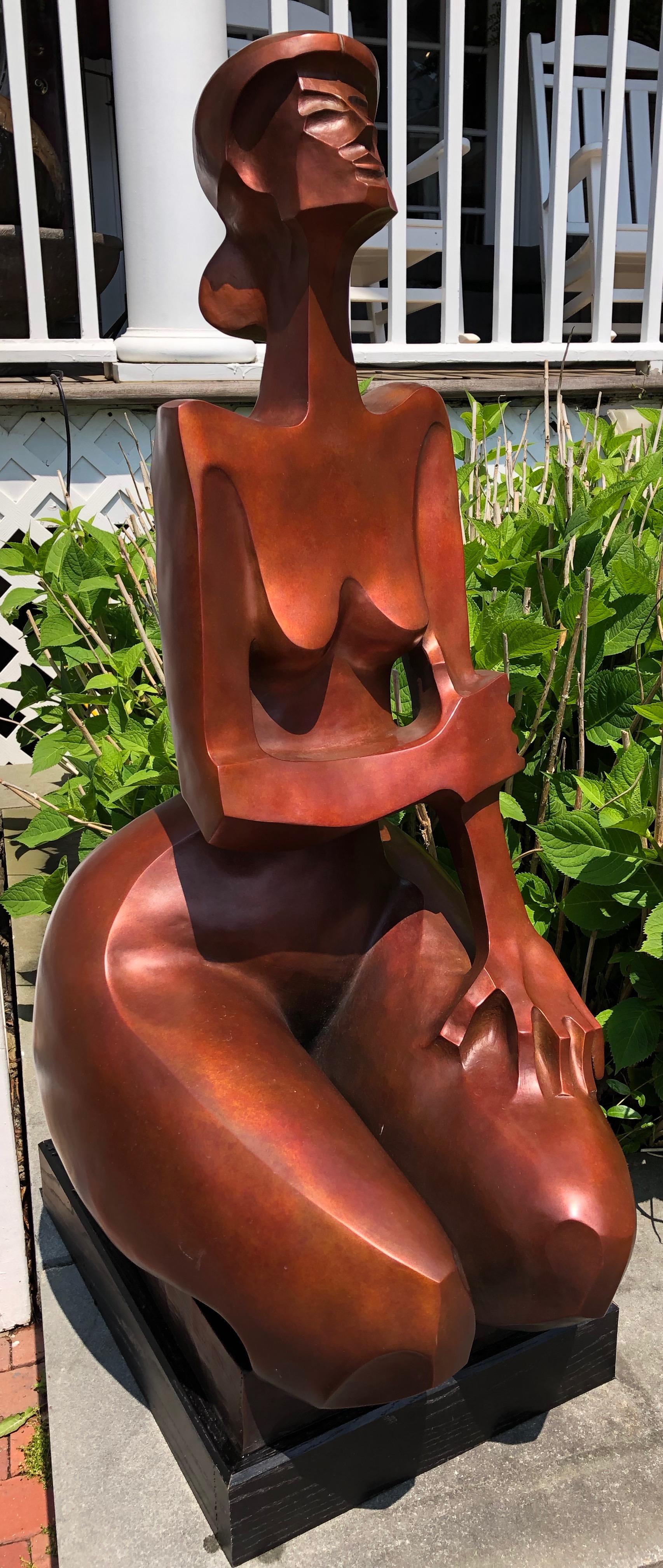 "Augusta 6/12" Bronze sculpture of a nude woman kneeling in deep orange patina