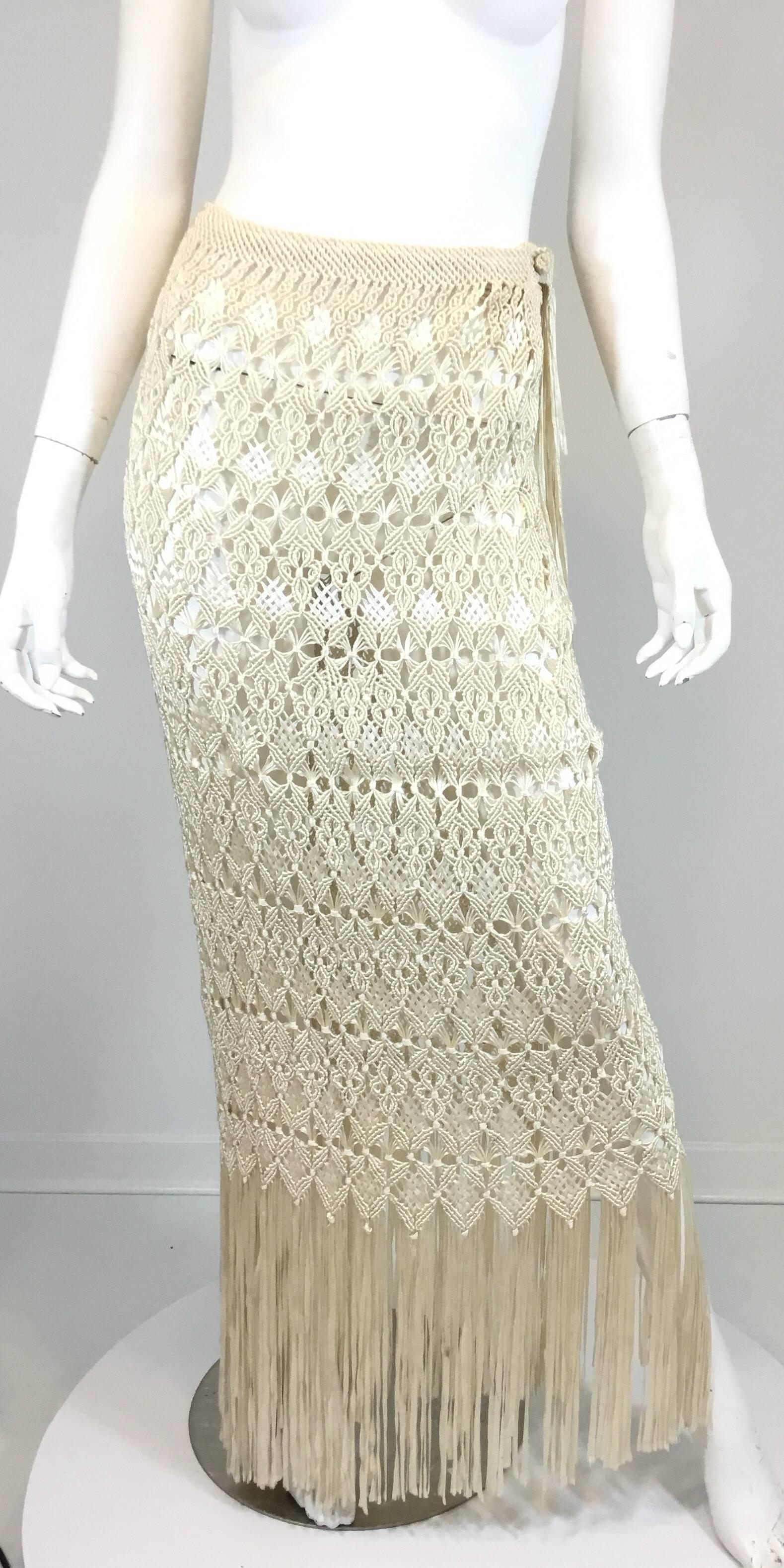Wayu handmade crochet shawl and skirt set in ivory/cream. Skirt has a knot button and loop closure along the left side. 

SHAWL:
length 53''

SKIRT: (model is a size 4-6)
waist 25'' + stretch
hips 27'' + Bias Stretch
length 44'' will get shorter as