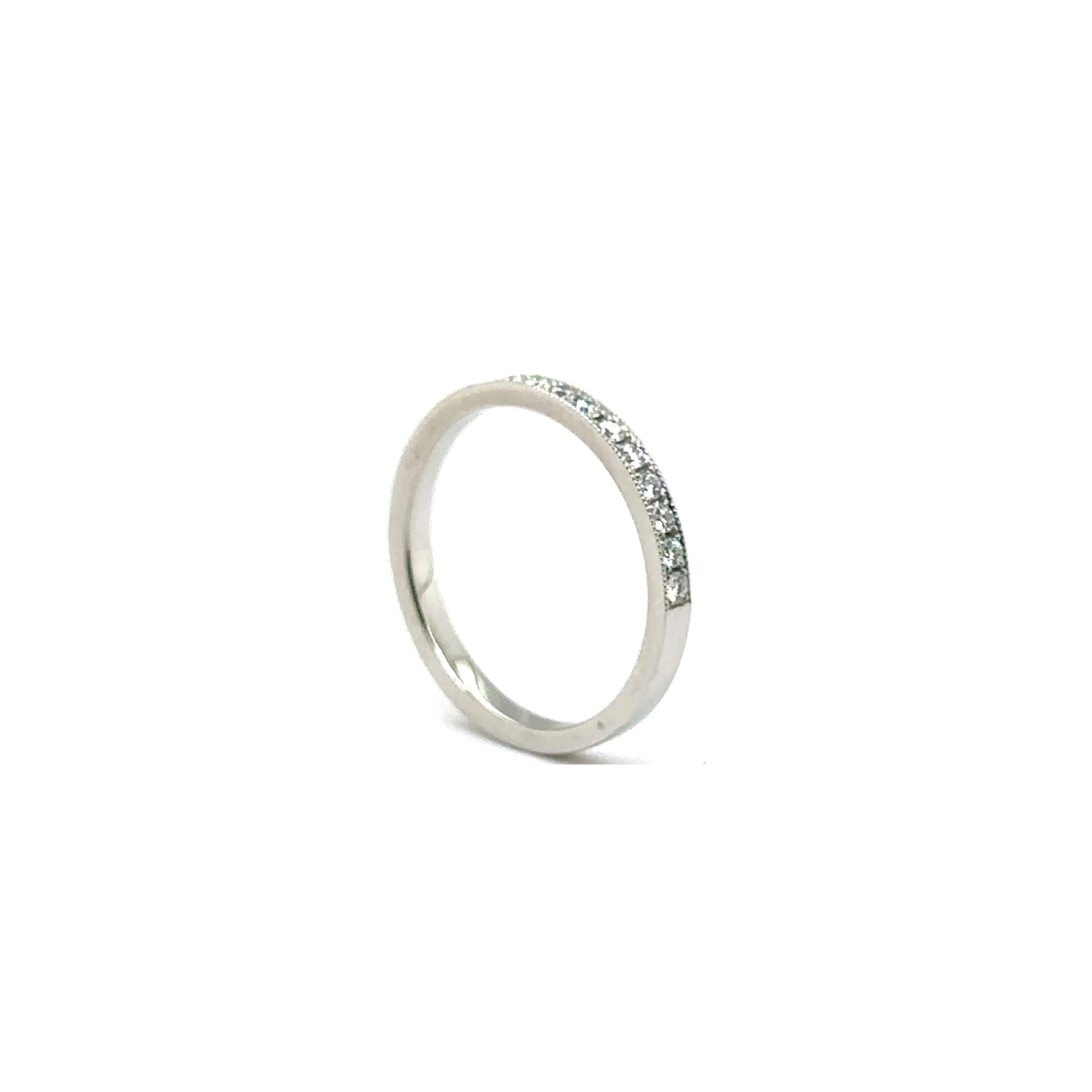 PLATINUM WEDDING BAND with 0.26 CT HALF WAY AROUND DIAMONDS
Metal: Platinum
Diamond Info: 
17 - G/VS ROUND BRILLIANT DIAMONDS 
SETTING MICRO PAVE BRIGHT CUT MILLI GRAIN  
Total Ct Weight:  0.26 cwt.
Item Weight: 2.86 gm
Ring Size: 6 1/4