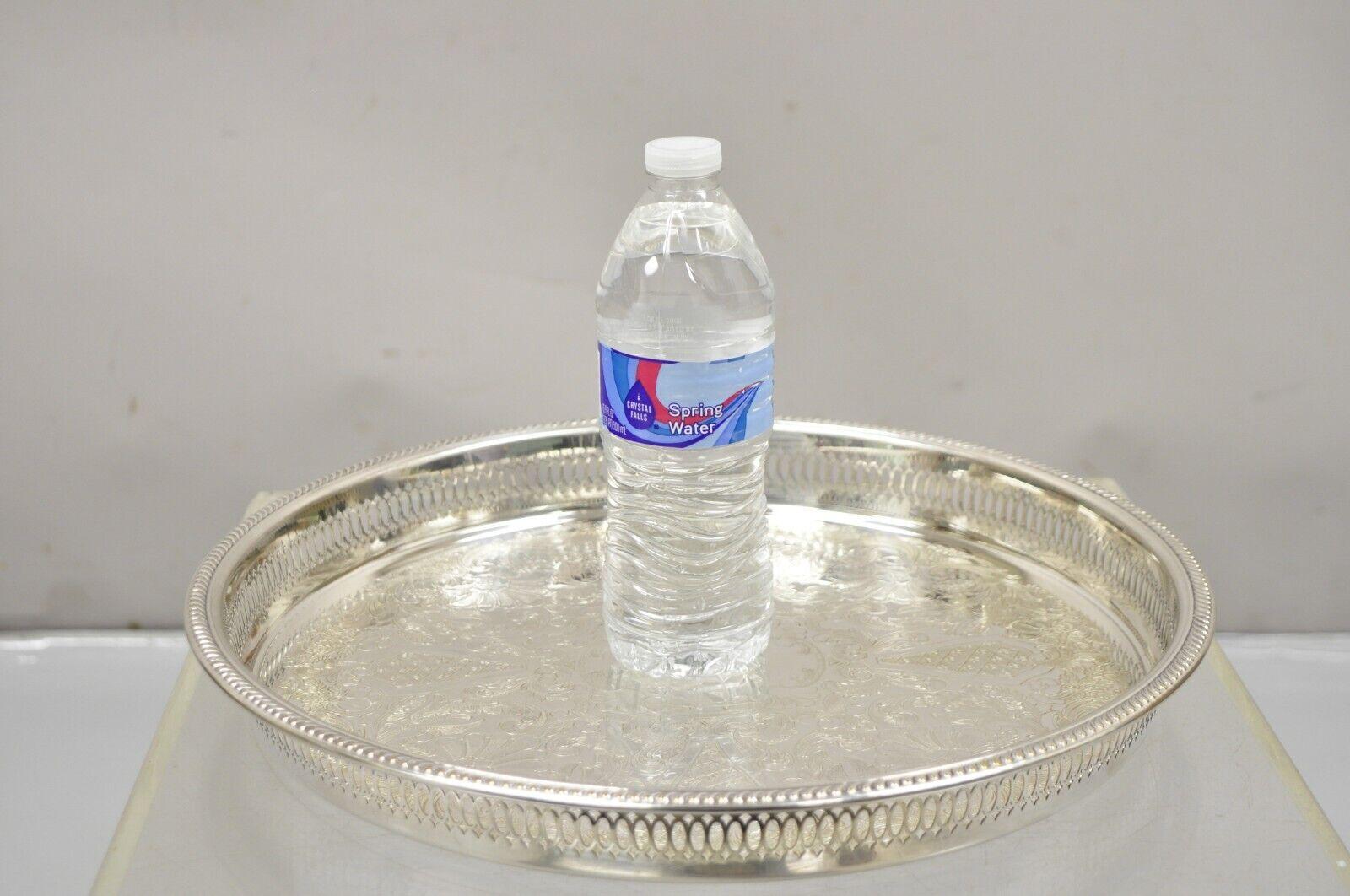 Vintage W B Rogers Silver Co Silver Plated Pierced Gallery 15” Serving Platter Tray. Item features an ornate etched center, raised pierced gallery, original hallmark. Circa Mid 20th Century. Measurements:  1.5