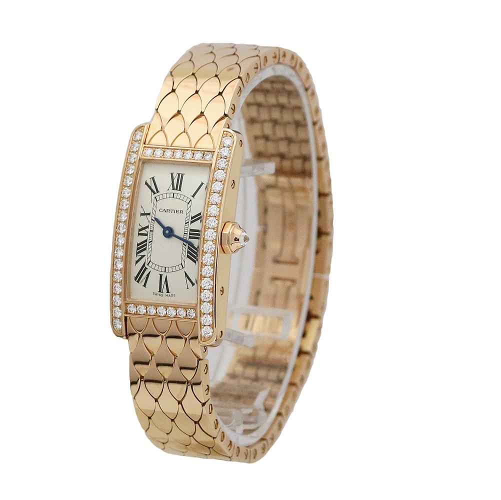 18K Rose Gold Cartier Tank Americaine Small Model Quartz Watch (WB710008). It Has 48 Diamonds Around The Bezel Weighing 1.00 Carats Total Weight And 1 Diamond G/VS1 On The Crown Weighing .84 Carats Total Weight.  It Has A 18K Rose Gold 19mm Case,