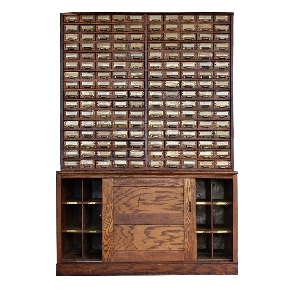 The W.C. Heller Company began manufacturing Industrial furniture in 1891 and is still operational today. This phenomenal cabinet is trademarked with the Montpelier, OH location, which puts its date of production sometime after 1906. It is a