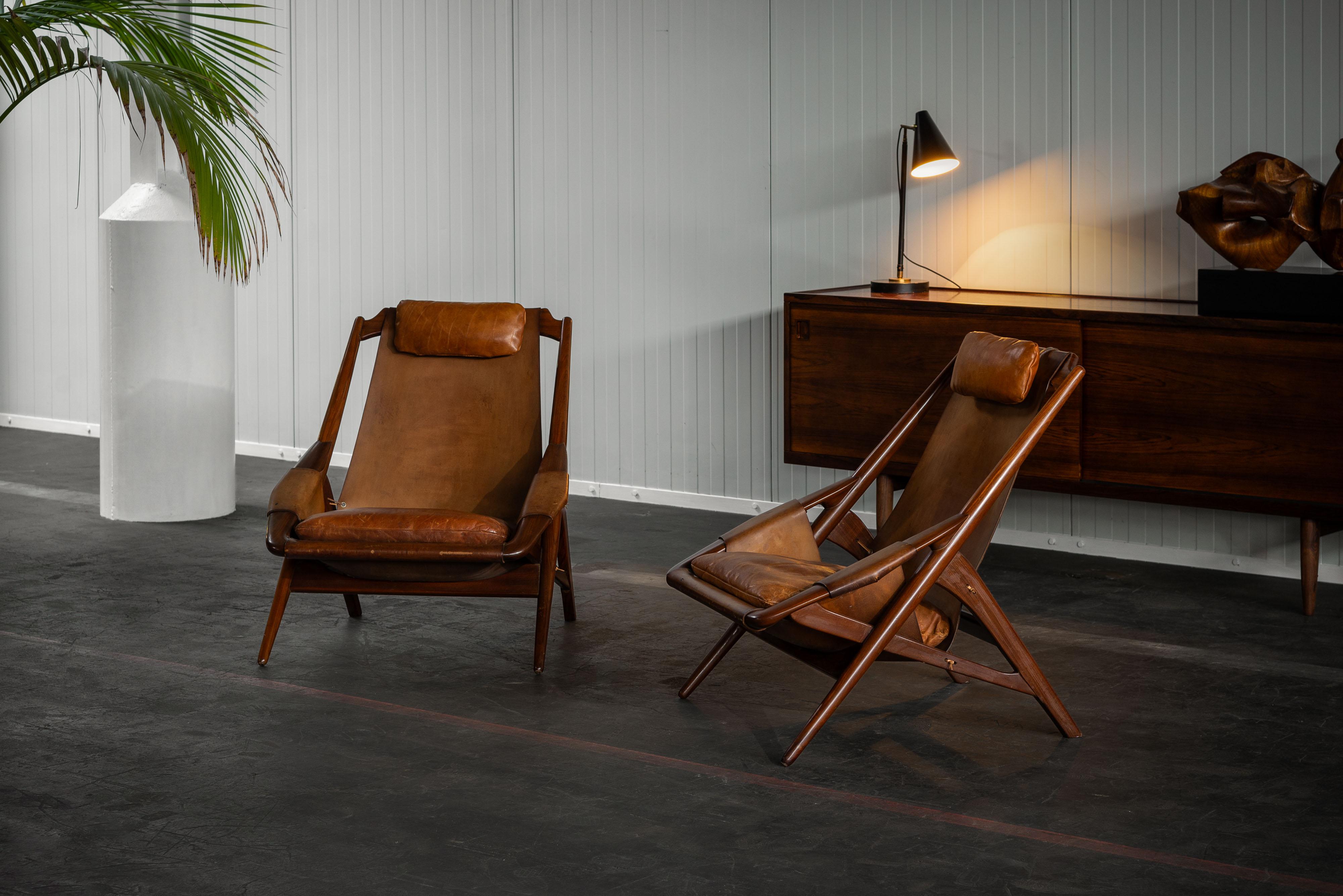 Highly rare original pair of hunting chairs designed by W.D. Andersag and manufactured by Piacenza in Italy in 1959.  The chairs have a stunning original patinated cognac leather. This patina makes them even more special and unique in their