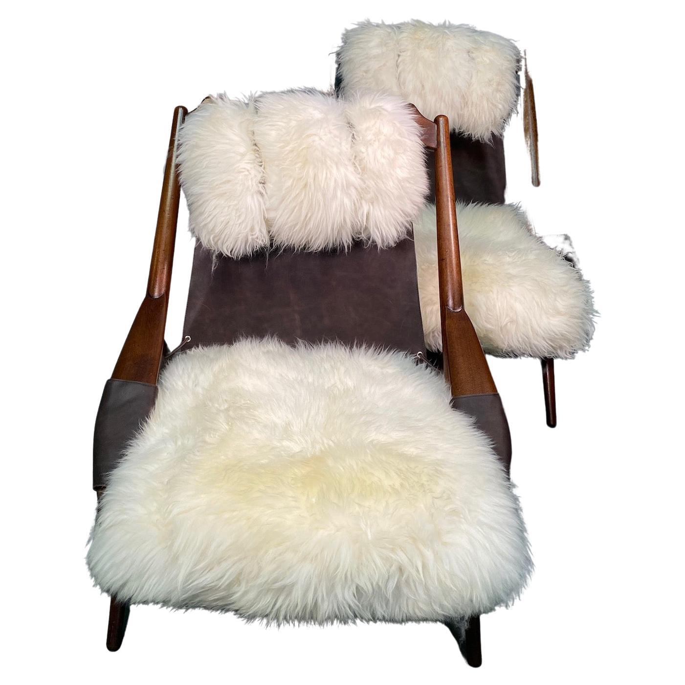 W.D. Andersag, lounge chair, mahogany and black leather Leather And Sheepskin Italy, 1960s. This chair is very dynamic due it's design and shapes. The frame shows beautiful lines.